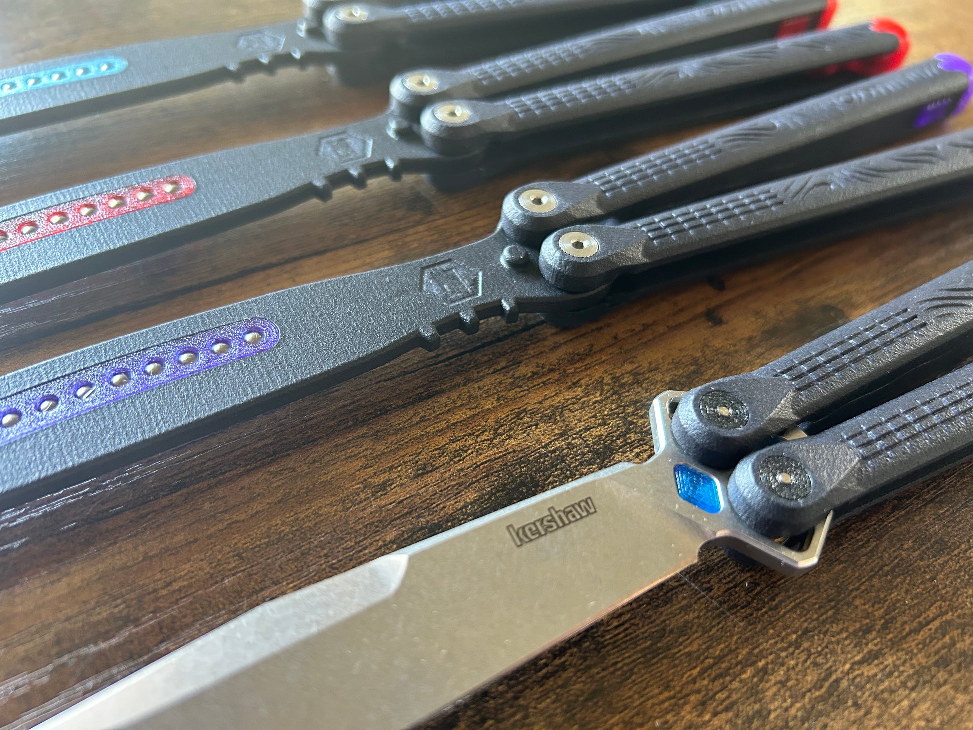 ZippyLucha handles (aka ZLucha) are a set of aftermarket handles for the Kershaw Lucha Balisong (live blade). They lighten the Lucha (3.62 oz), improve the balance for flipping, and introduce the high-performance threadlocker-free Zippy pivot/bearing system.