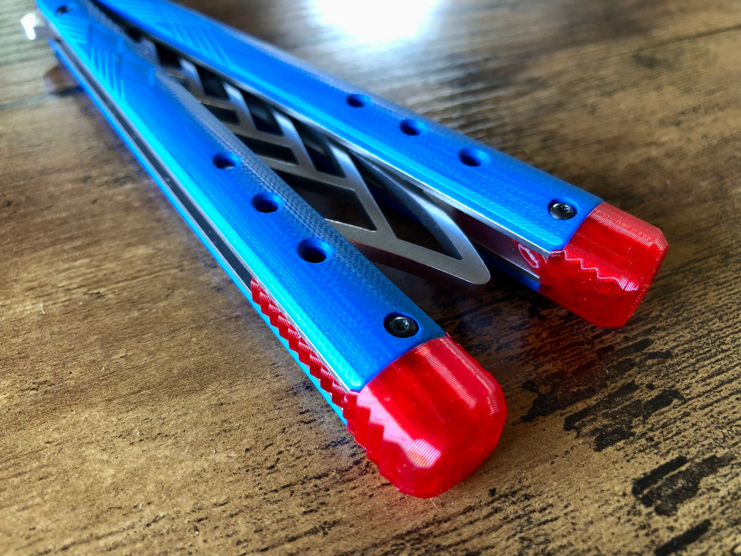 These Zippy spacers for the Benchmade Necron balisong are shatter-proof extensions that will protect your handles with no risk of cracking on hard-drops. They are available in 3x different lengths with removable tungsten weights for a more granular balance and length customization. They also offer positive jimping for extra grip, and install easily in just a few minutes (watch the assembly video above!). These spacers are a no-nonsense upgrade for the Necron.