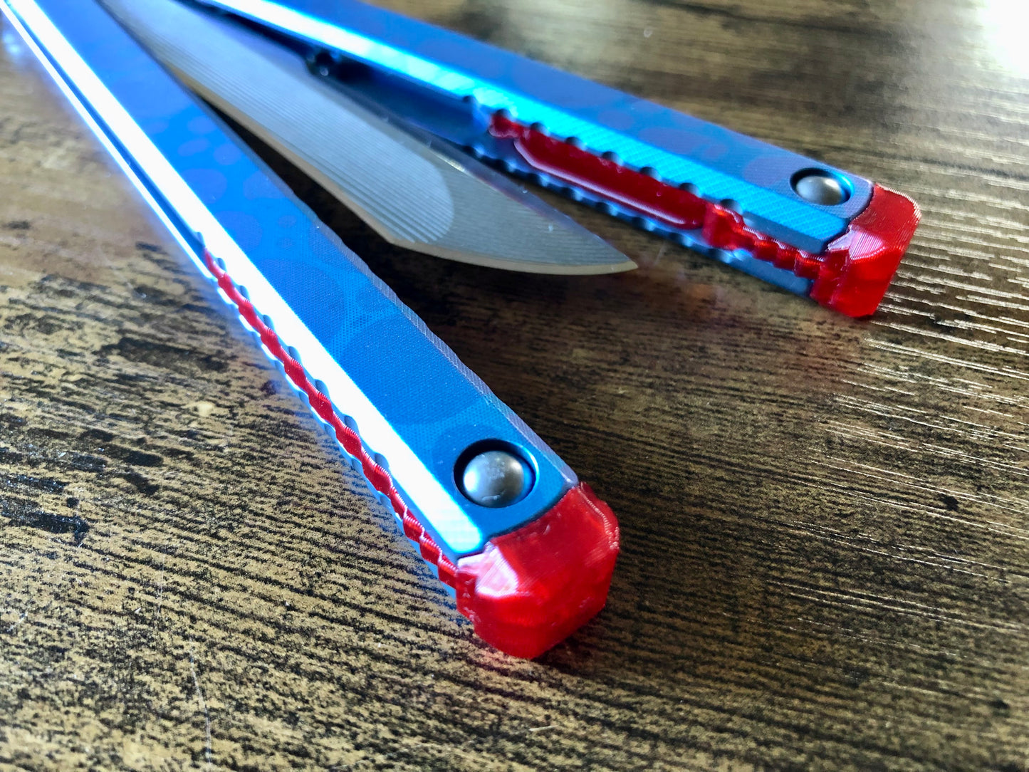 These Zippy spacers designed for the Fellowship Blades Gaboon balisong are made in-house from a rubbery, shatter-proof polyurethane. They add additional jimping to the Gaboon, and are also available as extensions which add handle length, protect the handles from drops, and include an adjustable tungsten weight system.