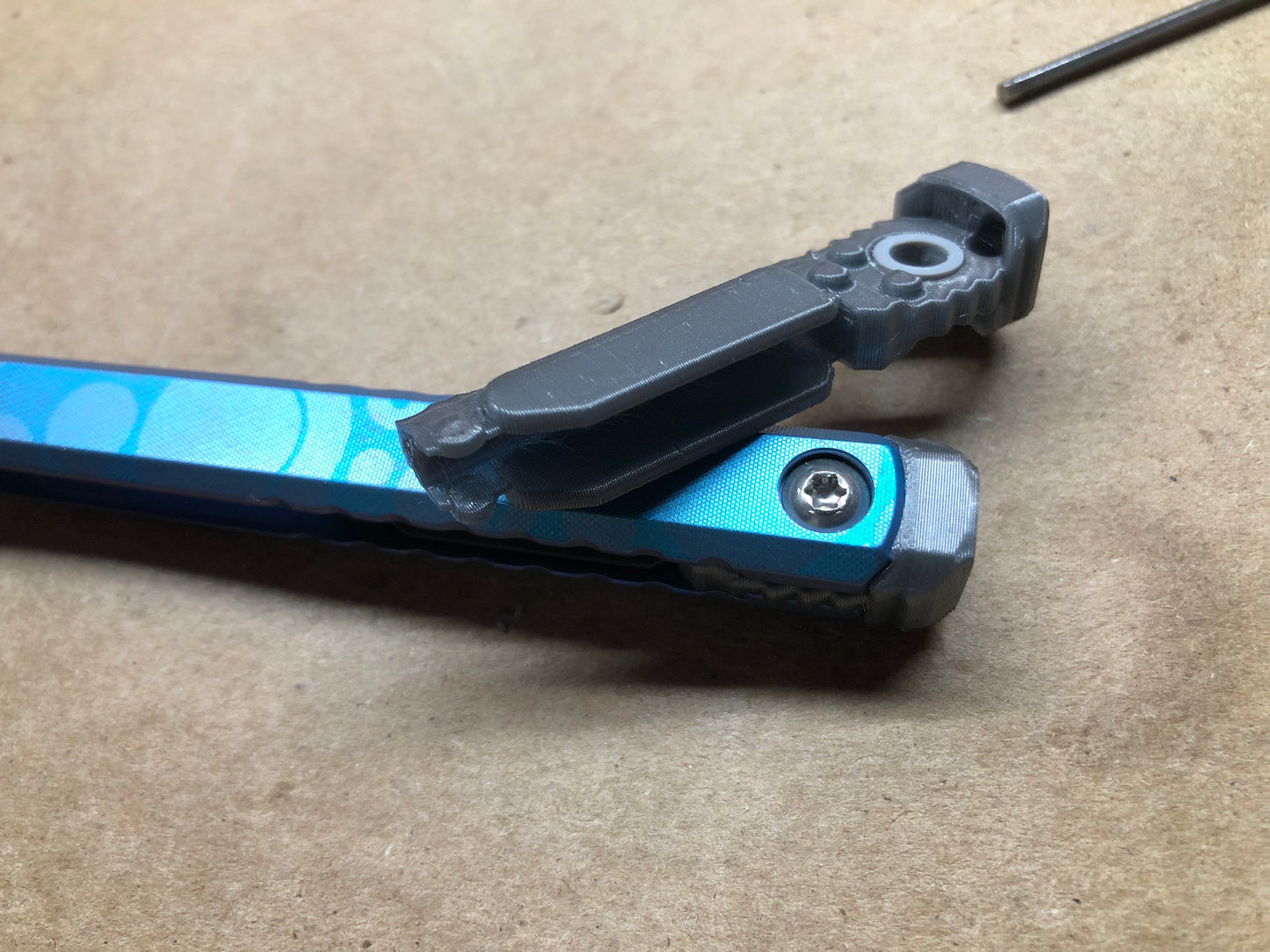 These Zippy spacers designed for the Fellowship Blades Gaboon balisong are made in-house from a rubbery, shatter-proof polyurethane. They add additional jimping to the Gaboon, and are also available as extensions which add handle length, protect the handles from drops, and include an adjustable tungsten weight system.