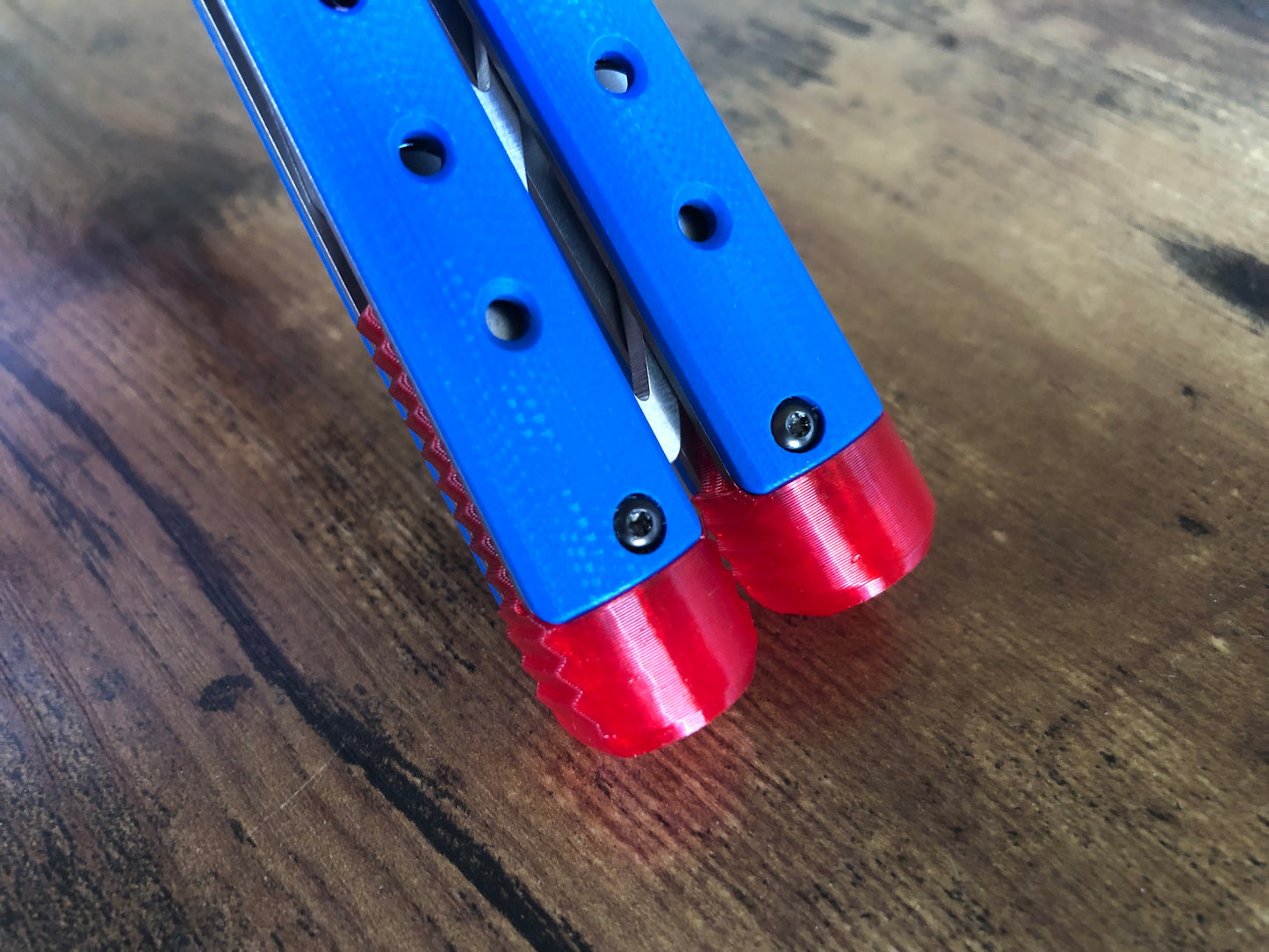 These Zippy spacers for the Benchmade Necron balisong are shatter-proof extensions that will protect your handles with no risk of cracking on hard-drops. They are available in 3x different lengths with removable tungsten weights for a more granular balance and length customization. They also offer positive jimping for extra grip, and install easily in just a few minutes (watch the assembly video above!). These spacers are a no-nonsense upgrade for the Necron.