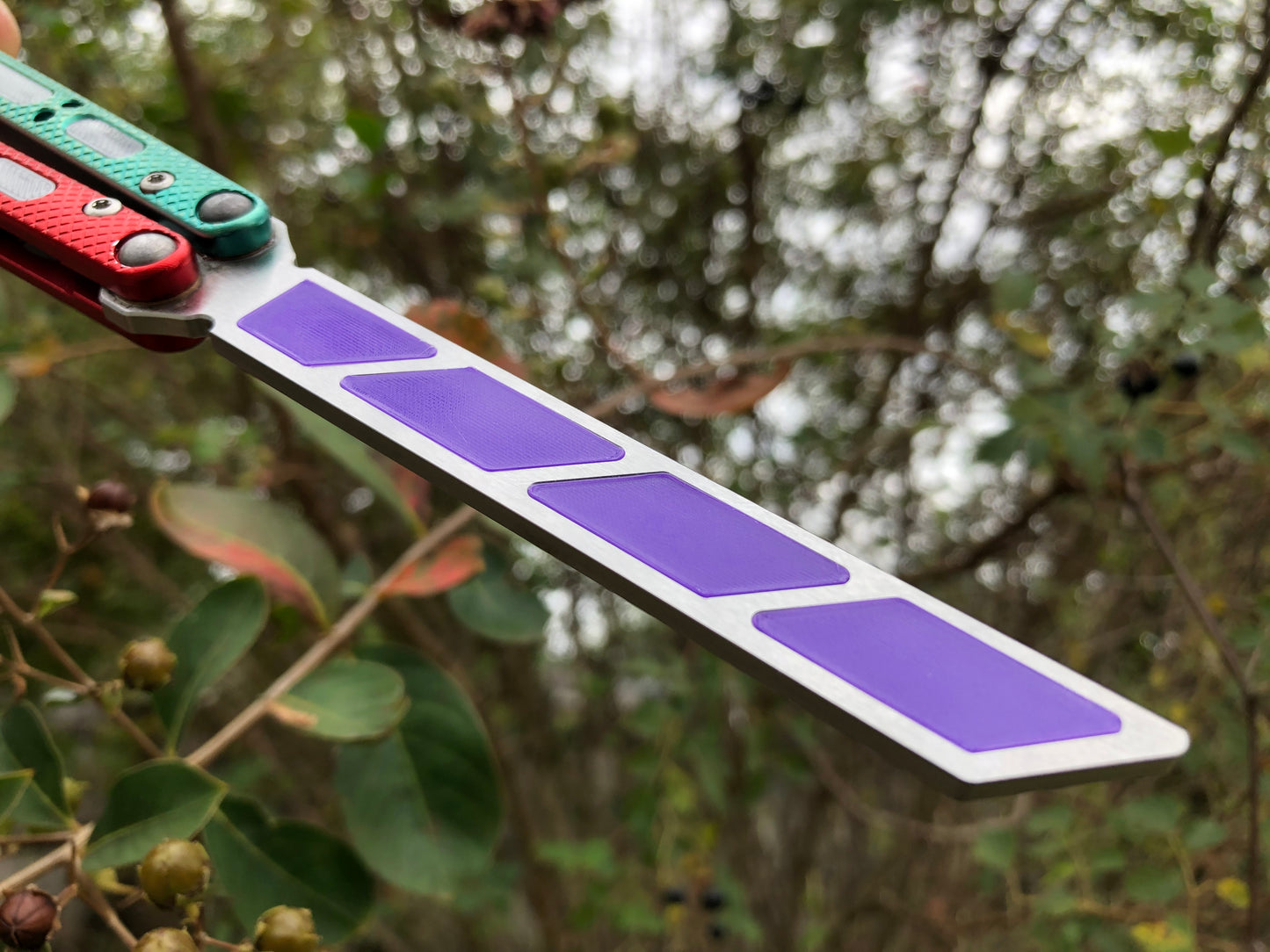 Add blade weight and a pop of color to your NRB Ultralight balisong trainer with these custom-made Zippy blade inserts. The inserts are made of a shatter-proof polyurethane with an edge lip, so they won't fall out on drops. The inserts enable you to modify the balance of your Ultralight and can be used to compensate for the added handle weight from the Zippy handle inlays.