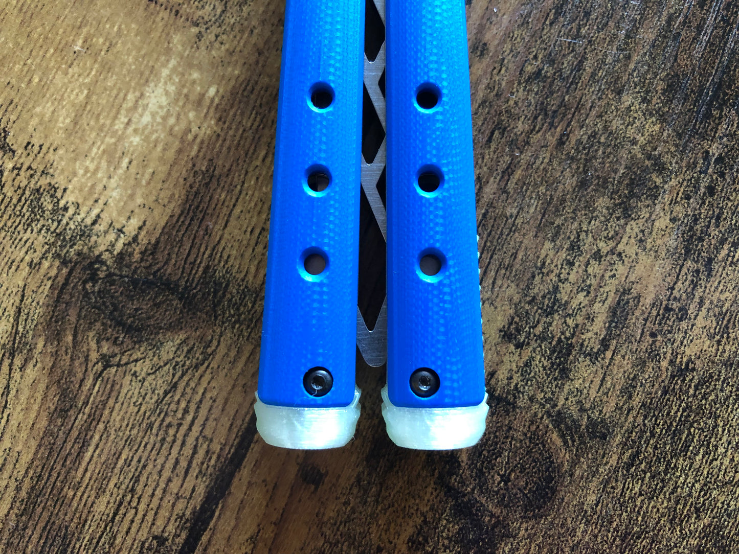 These Zippy spacers for the Benchmade Necron balisong are shatter-proof extensions that will protect your handles with no risk of cracking on hard-drops. They are available in 3x different lengths with removable tungsten weights for a more granular balance and length customization. They also offer positive jimping for extra grip, and install easily in just a few minutes (watch the assembly video above!). These spacers are a no-nonsense upgrade for the Necron.