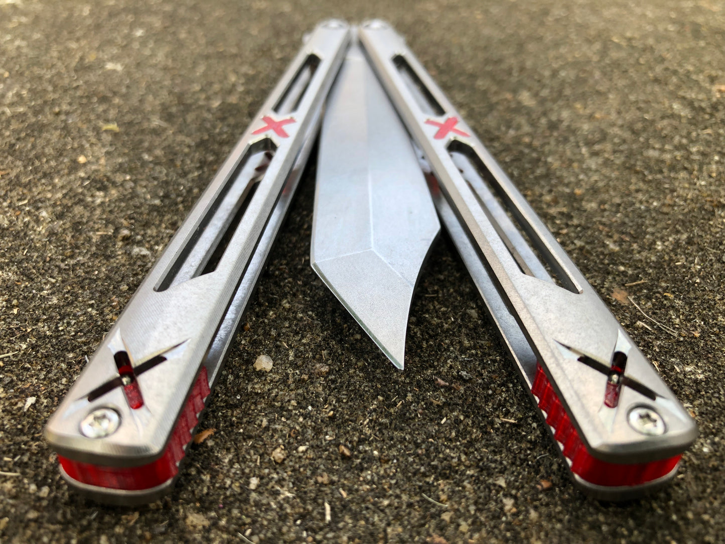 Made by Bxndxge Knives (Bandage, not bondage!) in collaboration with Zippy, the "Stitch" handles are a Titanium rehandle mod compatible with blades from both the BRS Replicant and Squid Industries Krake Raken balisongs.