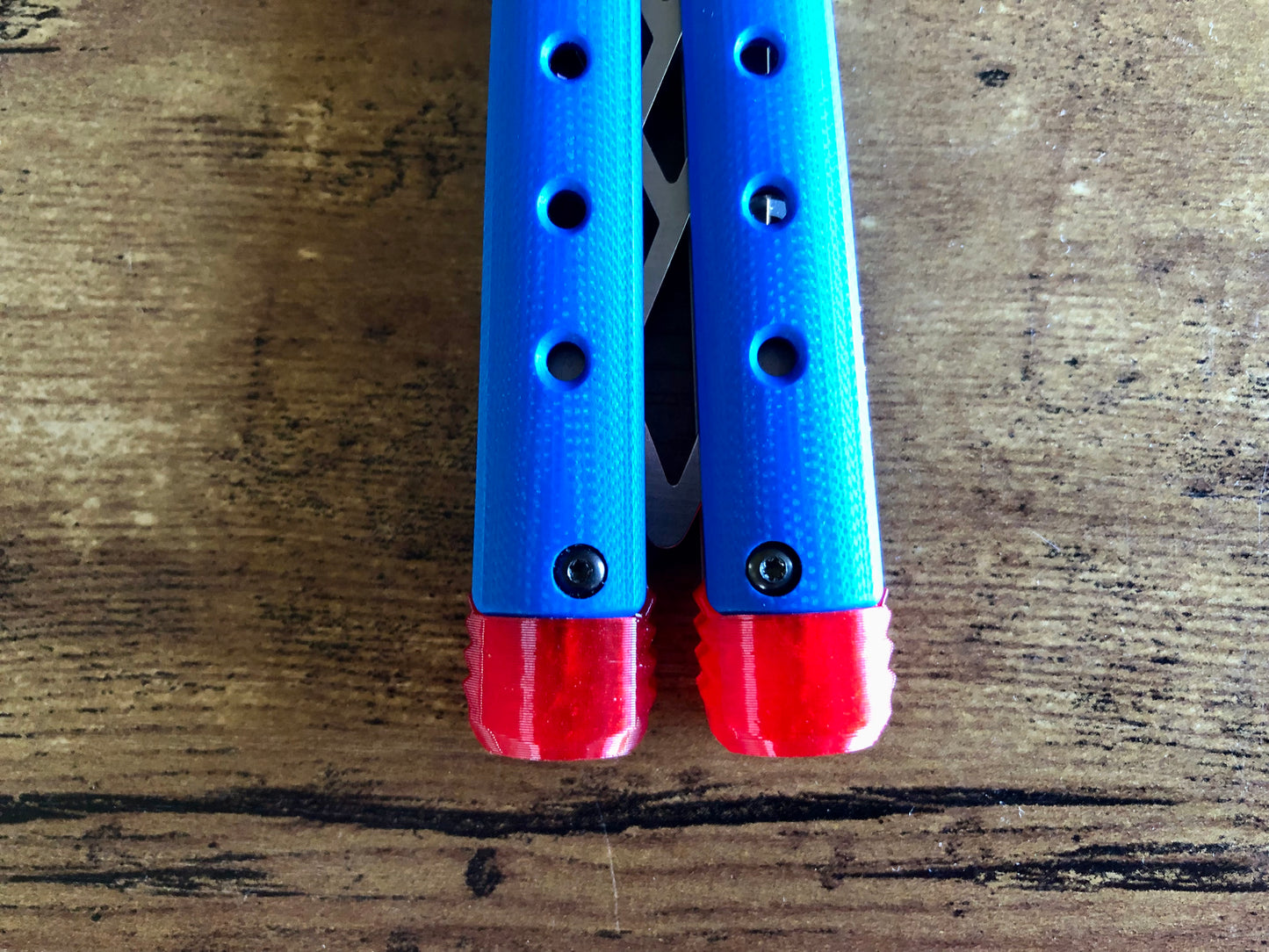 These Zippy spacers for the Benchmade Necron balisong are shatter-proof extensions that will protect your handles with no risk of cracking on hard-drops. They are available in 3x different lengths with removable tungsten weights for a more granular balance and length customization. They also offer positive jimping for extra grip, and install easily in just a few minutes (watch the assembly video above!). These spacers are a no-nonsense upgrade for the Necron.