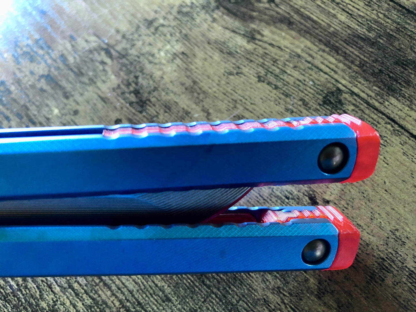 These Zippy spacers designed for the Fellowship Blades Gaboon balisong are made in-house from a rubbery, shatter-proof polyurethane. They add additional jimping to the Gaboon, and are also available as extensions which add handle length, protect the handles from drops, and include an adjustable tungsten weight system.