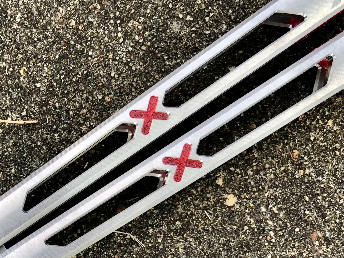 Made by Bxndxge Knives (Bandage, not bondage!) in collaboration with Zippy, the "Stitch" handles are a Titanium rehandle mod compatible with blades from both the BRS Replicant and Squid Industries Krake Raken balisongs.