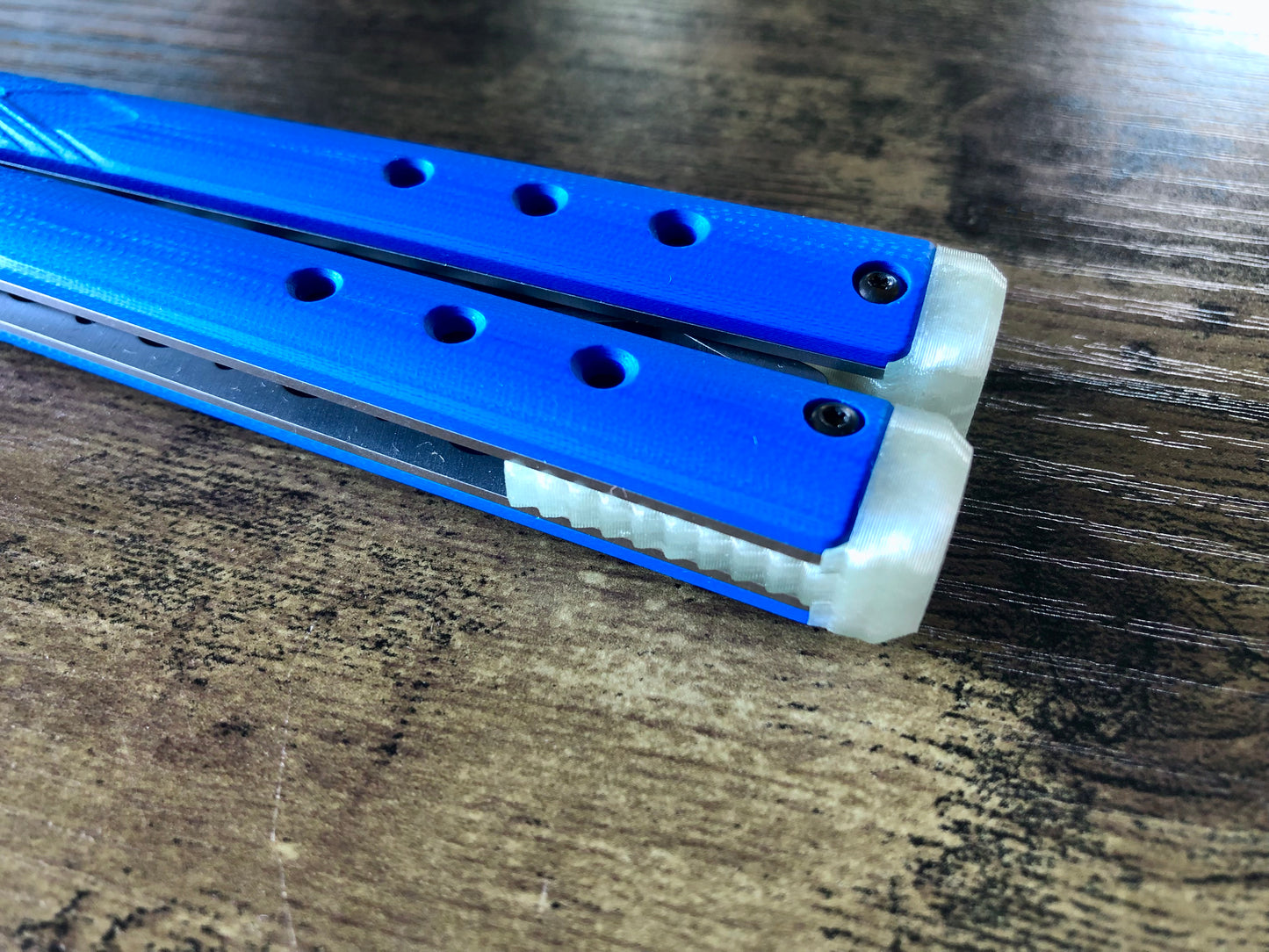 These Zippy spacers for the Benchmade Necron balisong are shatter-proof extensions that will protect your handles with no risk of cracking on hard-drops. They are available in 3x different lengths with removable tungsten weights for a more granular balance and length customization. They also offer positive jimping for extra grip, and install easily in just a few minutes (watch the assembly video above!). These spacers are a no-nonsense upgrade for the Necron.