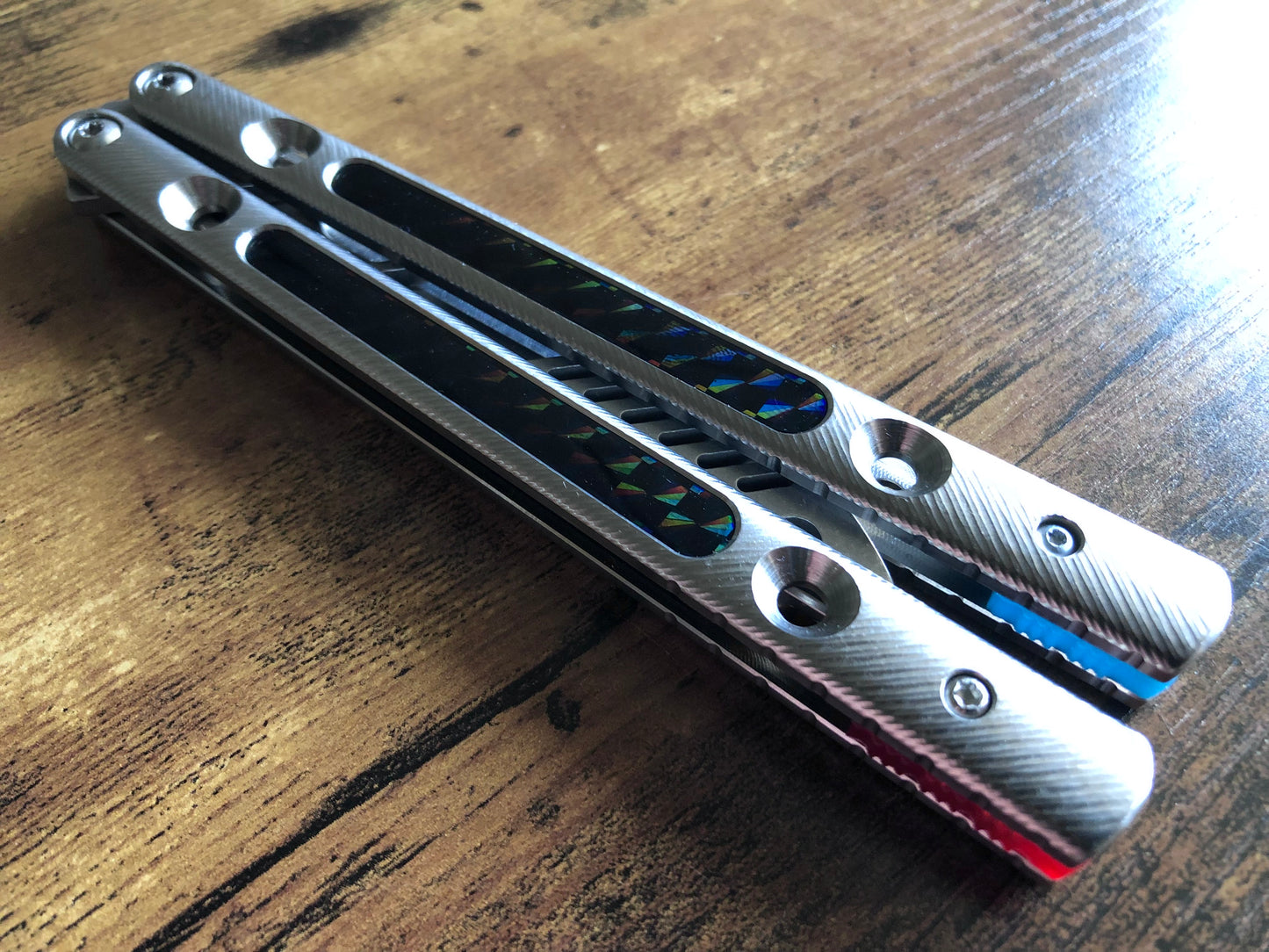 Zippy spacers reduce the handle bias and add positive jimping to your Squiggle Krake, while the inlays add grip and comfort. Individually, both spacers and the inlays eliminate ring and are designed to fit the titanium Squiggle handles for the Squid Industries Krake Raken balisong.
