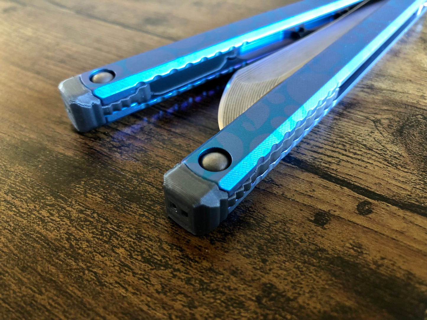 These Zippy spacers designed for the Fellowship Blades Gaboon balisong are made in-house from a rubbery, shatter-proof polyurethane. They add additional jimping to the Gaboon, and are also available as extensions which add handle length, protect the handles from drops, and include an adjustable tungsten weight system.