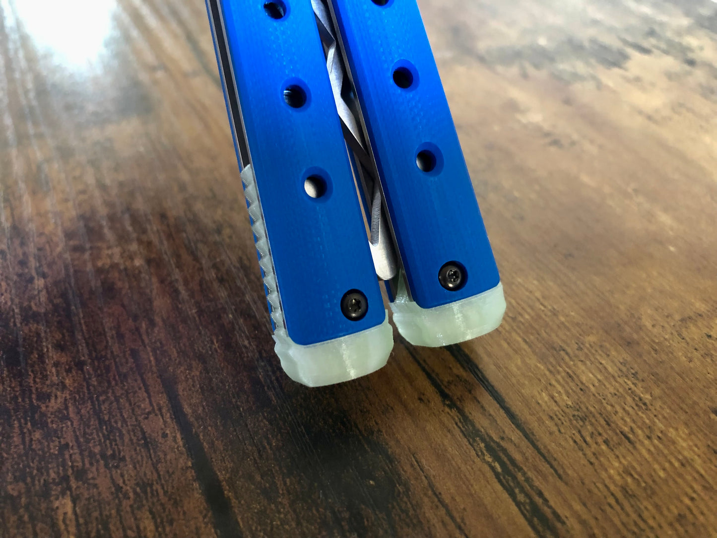 These Zippy spacers for the Benchmade Necron balisong are shatter-proof extensions that will protect your handles with no risk of cracking on hard-drops. They are available in 3x different lengths with removable tungsten weights for a more granular balance and length customization. They also offer positive jimping for extra grip, and install easily in just a few minutes (watch the assembly video above!). These spacers are a no-nonsense upgrade for the Necron.