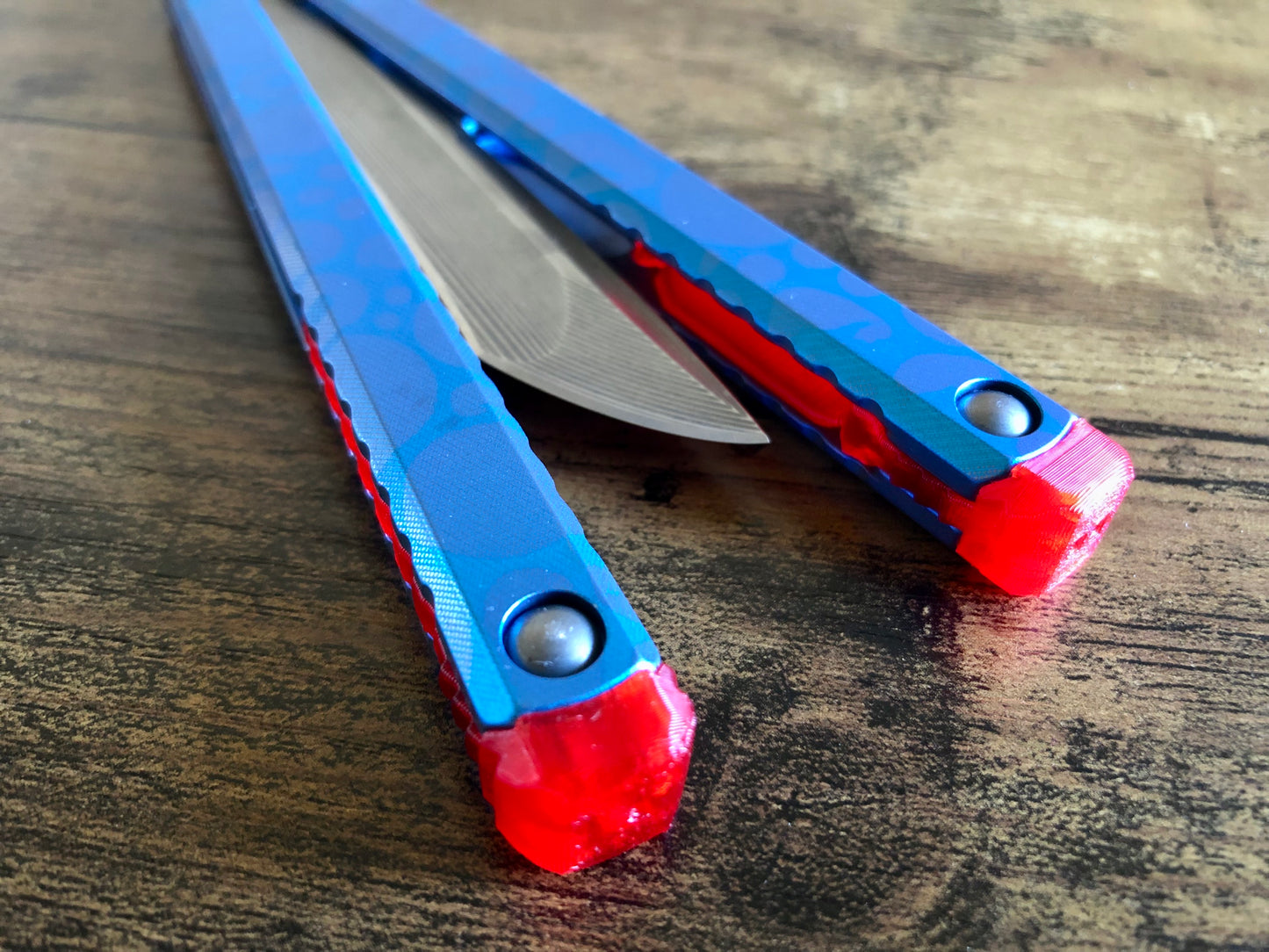These Zippy spacers designed for the Fellowship Blades Gaboon balisong are made in-house from a rubbery, shatter-proof polyurethane. They add additional jimping to the Gaboon, and are also available as extensions which add handle length, protect the handles from drops, and include an adjustable tungsten weight system.