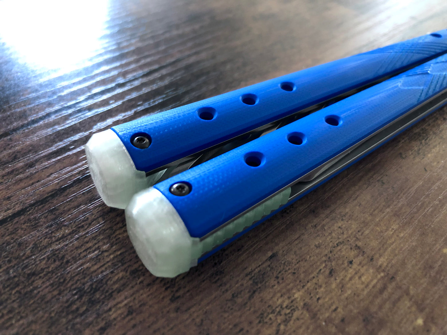 These Zippy spacers for the Benchmade Necron balisong are shatter-proof extensions that will protect your handles with no risk of cracking on hard-drops. They are available in 3x different lengths with removable tungsten weights for a more granular balance and length customization. They also offer positive jimping for extra grip, and install easily in just a few minutes (watch the assembly video above!). These spacers are a no-nonsense upgrade for the Necron.