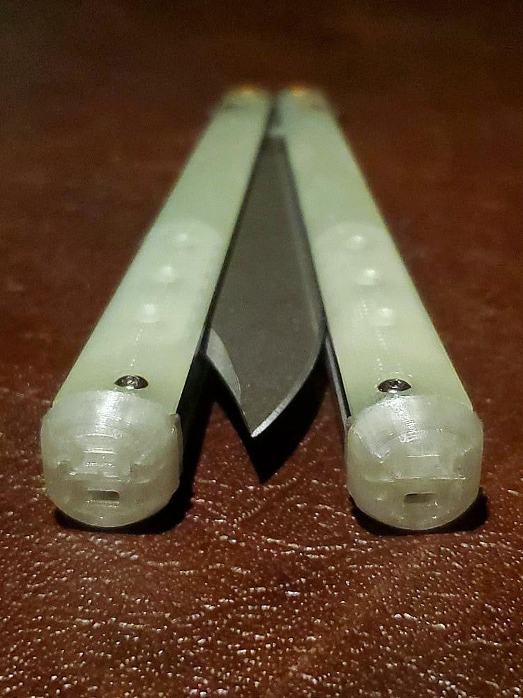 These Zippy spacers for the Benchmade Necron balisong are shatter-proof extensions that will protect your handles with no risk of cracking on hard-drops. They are available in 3x different lengths with removable tungsten weights for a more granular balance and length customization. They also offer positive jimping for extra grip, and install easily in just a few minutes (watch the assembly video above!). These spacers are a no-nonsense upgrade for the Necron.