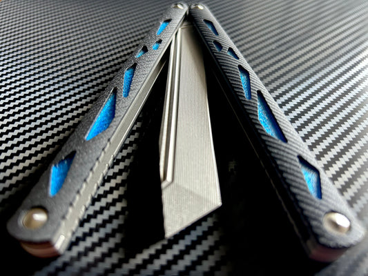 These cosmetic Zippy handle inlays are designed for the Maranza Zika butterfly knife and add a pop of color without changing the balance. The Maranza Zika balisong is a collaboration between AcidWRX and Ceroni Knives, and now it has aftermarket support from Zippy.