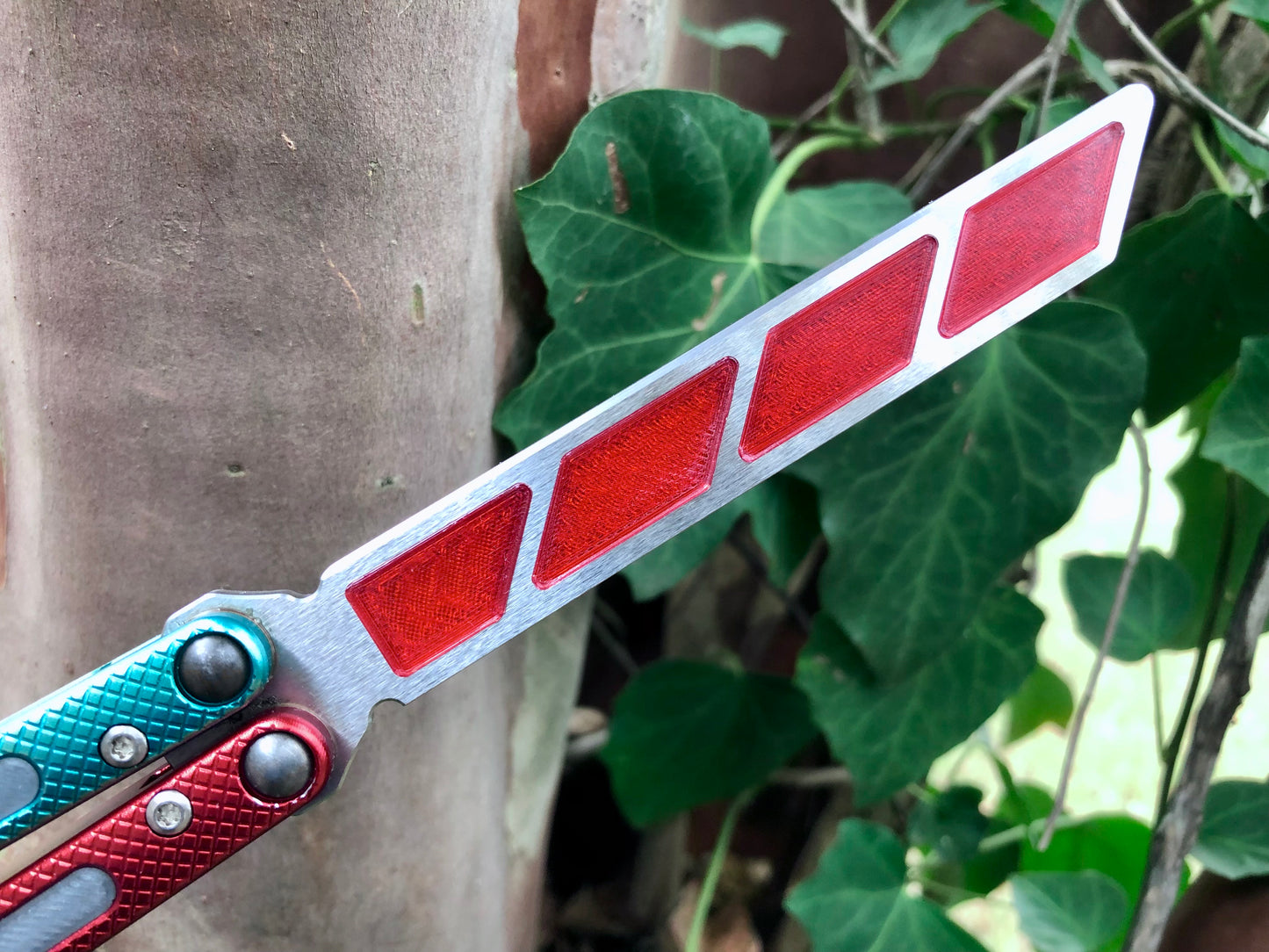 Add blade weight and a pop of color to your NRB Ultralight balisong trainer with these custom-made Zippy blade inserts. The inserts are made of a shatter-proof polyurethane with an edge lip, so they won't fall out on drops. The inserts enable you to modify the balance of your Ultralight and can be used to compensate for the added handle weight from the Zippy handle inlays.