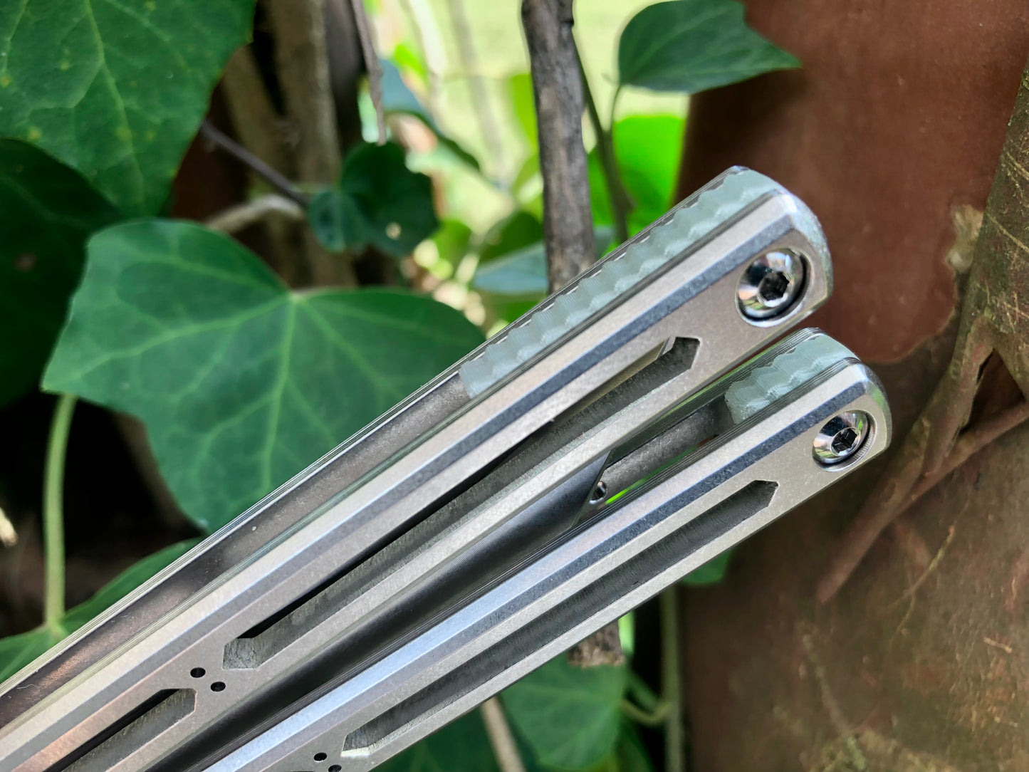 These Zippy spacers designed for the Squid Industries Hydro Balisong are made in-house from a rubbery, shatter-proof polyurethane. They add positive "sawtooth" jimping to the Hydro and are available as either full-length flush spacers for a more neutral balance, or handle extensions (with an adjustable tungsten weight system) to protect the handles from drops and increase momentum. A cosmetic blade insert is included.