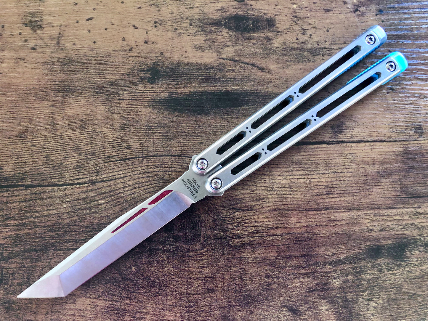 These Zippy spacers designed for the Squid Industries Hydro Balisong are made in-house from a rubbery, shatter-proof polyurethane. They add positive "sawtooth" jimping to the Hydro and are available as either full-length flush spacers for a more neutral balance, or handle extensions (with an adjustable tungsten weight system) to protect the handles from drops and increase momentum. A cosmetic blade insert is included.