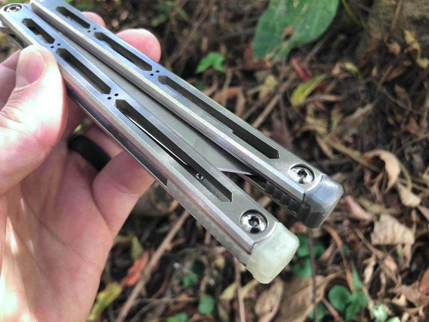 These Zippy spacers designed for the Squid Industries Hydro Balisong are made in-house from a rubbery, shatter-proof polyurethane. They add positive "sawtooth" jimping to the Hydro and are available as either full-length flush spacers for a more neutral balance, or handle extensions (with an adjustable tungsten weight system) to protect the handles from drops and increase momentum. A cosmetic blade insert is included.