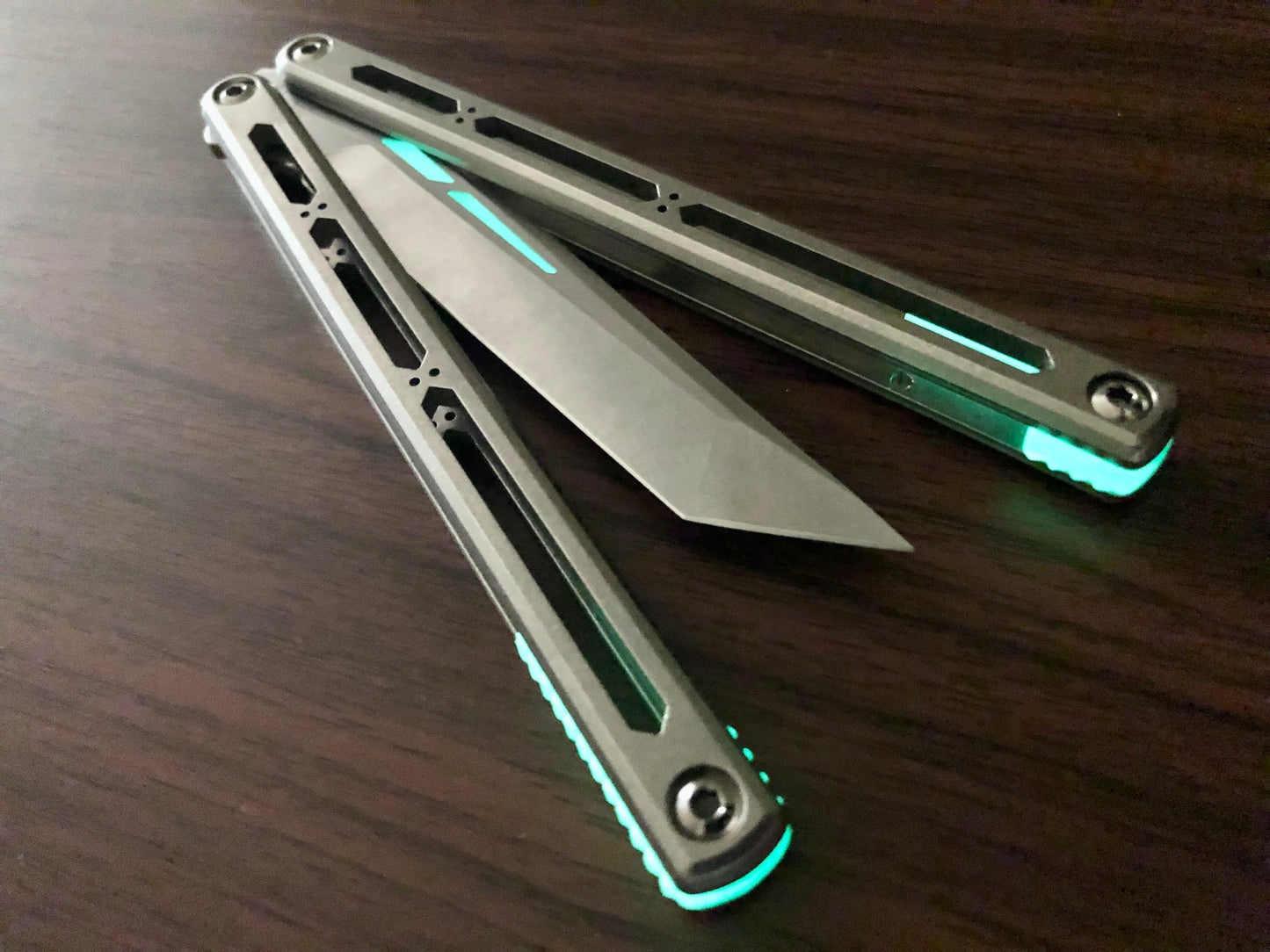 These Zippy spacers designed for the Squid Industries Hydro Balisong are made in-house from a rubbery, shatter-proof polyurethane. They add positive "sawtooth" jimping to the Hydro and are available as either full-length flush spacers for a more neutral balance, or handle extensions (with an adjustable tungsten weight system) to protect the handles from drops and increase momentum. A cosmetic blade insert is included.
