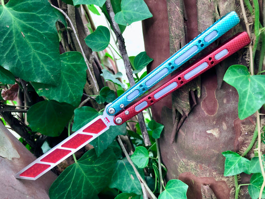 Add blade weight and a pop of color to your NRB Ultralight balisong trainer with these custom-made Zippy blade inserts. The inserts are made of a shatter-proof polyurethane with an edge lip, so they won't fall out on drops. The inserts enable you to modify the balance of your Ultralight and can be used to compensate for the added handle weight from the Zippy handle inlays.