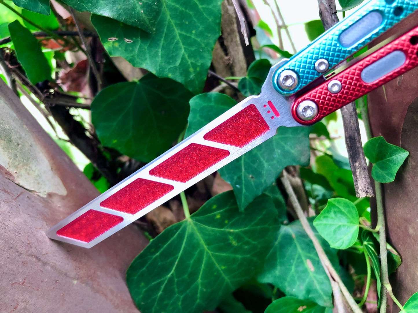 Add blade weight and a pop of color to your NRB Ultralight balisong trainer with these custom-made Zippy blade inserts. The inserts are made of a shatter-proof polyurethane with an edge lip, so they won't fall out on drops. The inserts enable you to modify the balance of your Ultralight and can be used to compensate for the added handle weight from the Zippy handle inlays.
