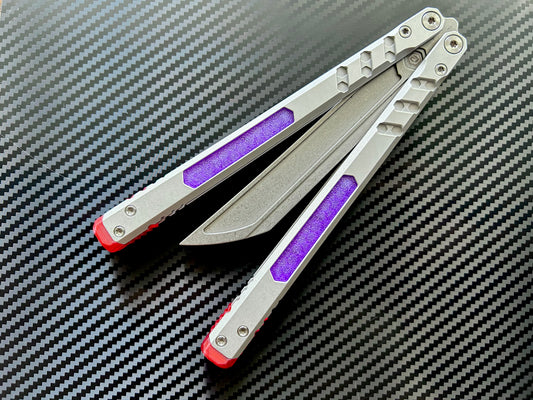 Perfect the balance and ergo of your BRS E-Volve Hex butterfly knife trainer with these custom-made Zippy spacers. The spacers are made in-house from a shatter-proof polyurethane. The spacers extend the handles, feature positive jimping, and enable adjustable balance with up to 3x removable tungsten weights per spacer.