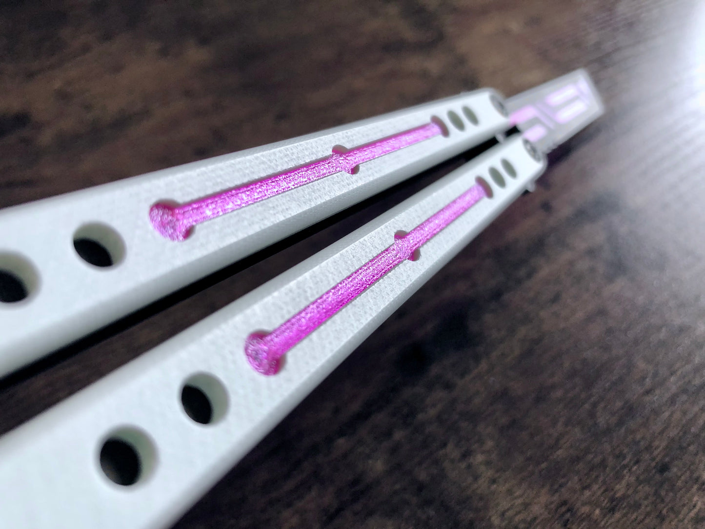 Modify the balance and add a pop of color to your Squid industries balisong trainer with these polyurethane blade inserts and handle inlays. The objective of this mod is to add blade weight for a slightly more neutral balance, with optional cosmetic handle inlays to add a pop of color.