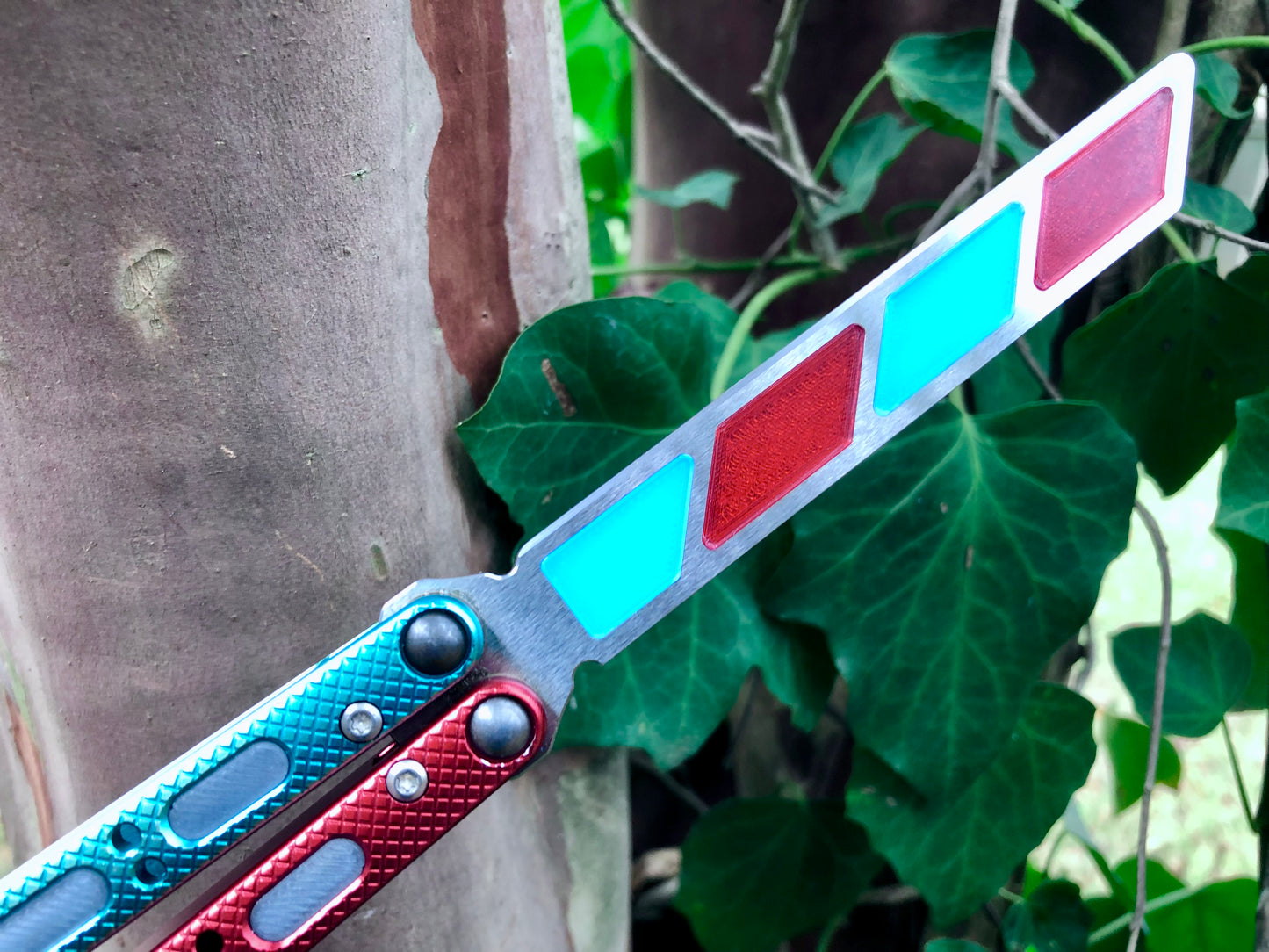 Add blade weight and a pop of color to your NRB Ultralight balisong trainer with these custom-made Zippy blade inserts. The inserts are made of a shatter-proof polyurethane with an edge lip, so they won't fall out on drops. The inserts enable you to modify the balance of your Ultralight and can be used to compensate for the added handle weight from the Zippy handle inlays.