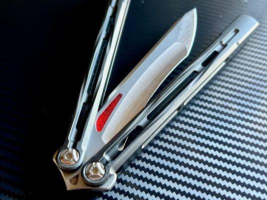 Add a pop of color to your Jewell Knives / Clarke Custom Lyra butterfly knife with these Zippy blade inlays. The inserts are made in-house from a shatter-proof polyurethane and won't pop out on drops.