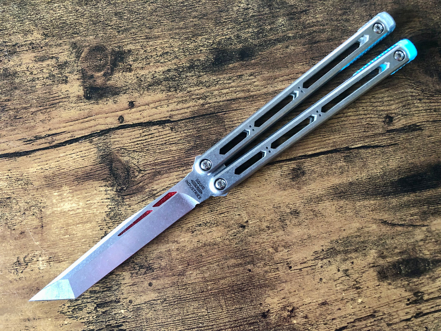 These Zippy spacers designed for the Squid Industries Hydro Balisong are made in-house from a rubbery, shatter-proof polyurethane. They add positive "sawtooth" jimping to the Hydro and are available as either full-length flush spacers for a more neutral balance, or handle extensions (with an adjustable tungsten weight system) to protect the handles from drops and increase momentum. A cosmetic blade insert is included.