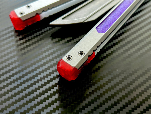 Perfect the balance and ergo of your BRS E-Volve Hex butterfly knife trainer with these custom-made Zippy spacers. The spacers are made in-house from a shatter-proof polyurethane. The spacers extend the handles, feature positive jimping, and enable adjustable balance with up to 3x removable tungsten weights per spacer.