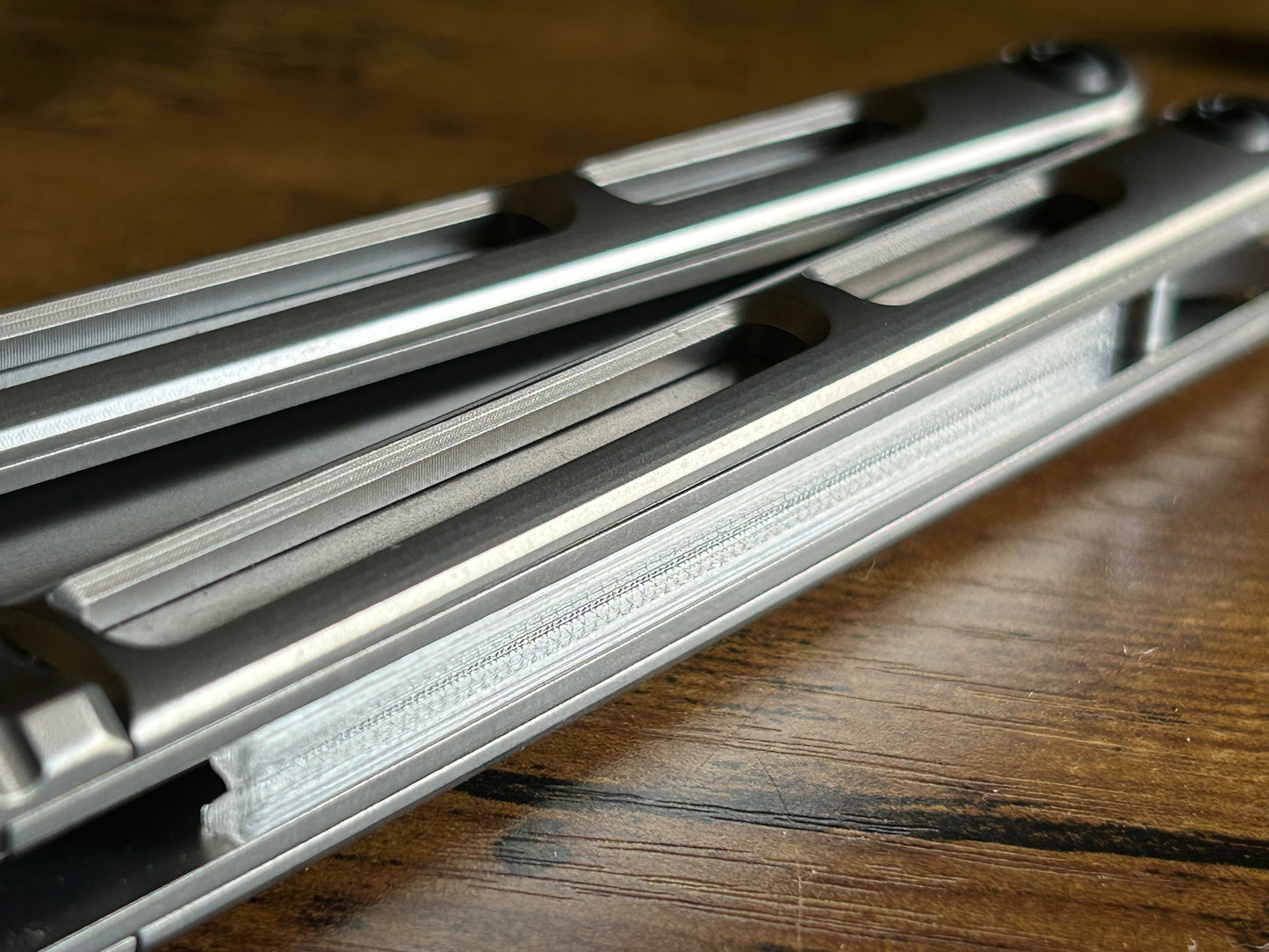 These ultra-lightweight Zippy speed channel inserts are custom-designed for the Andrew Myers Knife Works (AMKW) Aeon butterfly knife They add positive jimping to the Aeon for extra grip, deepen the sound, and dampen the ring.