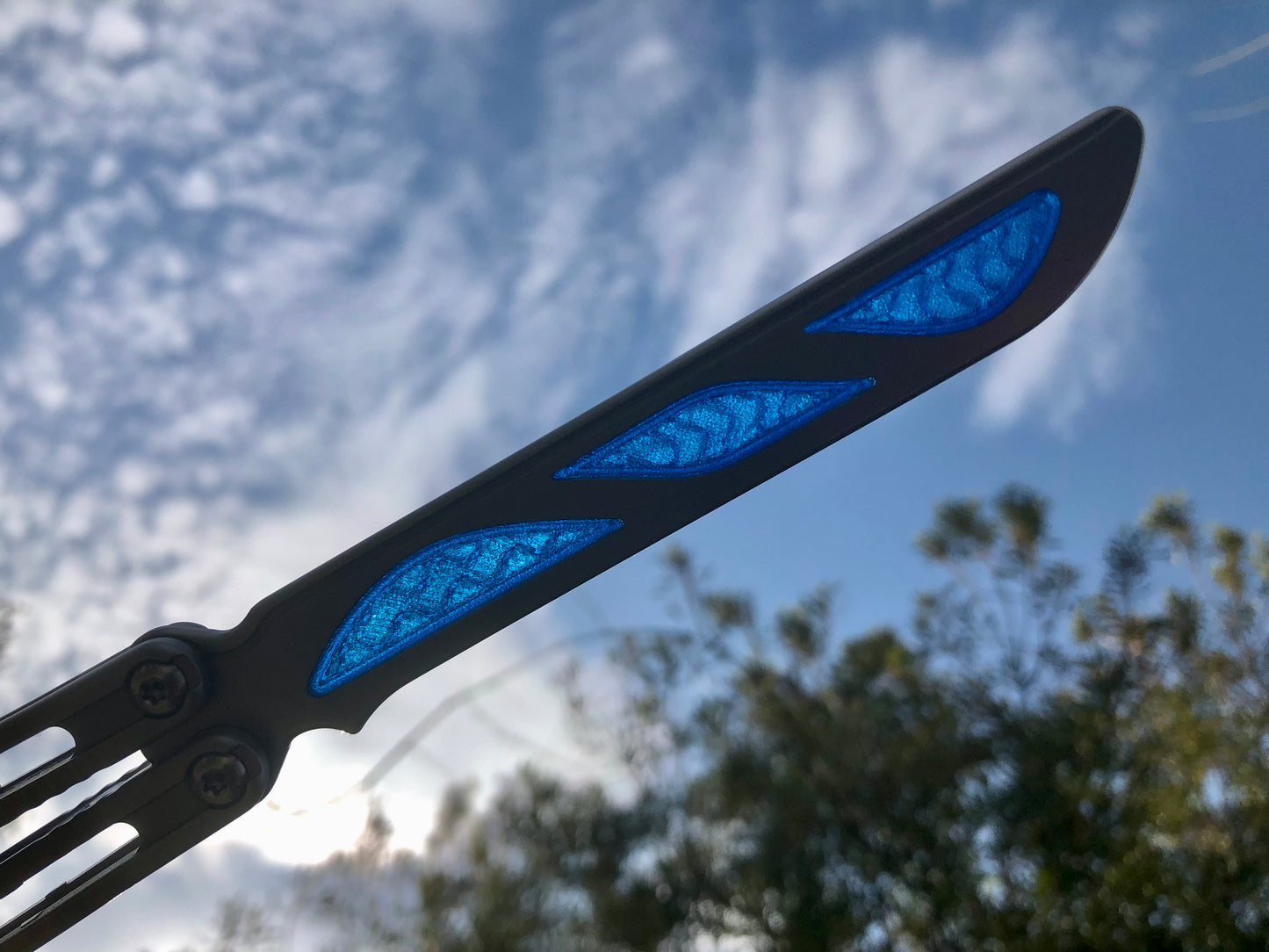 Silence the ring and adjust the weight distribution of your Nabalis Canyon balisong these custom-made Zippy inlays