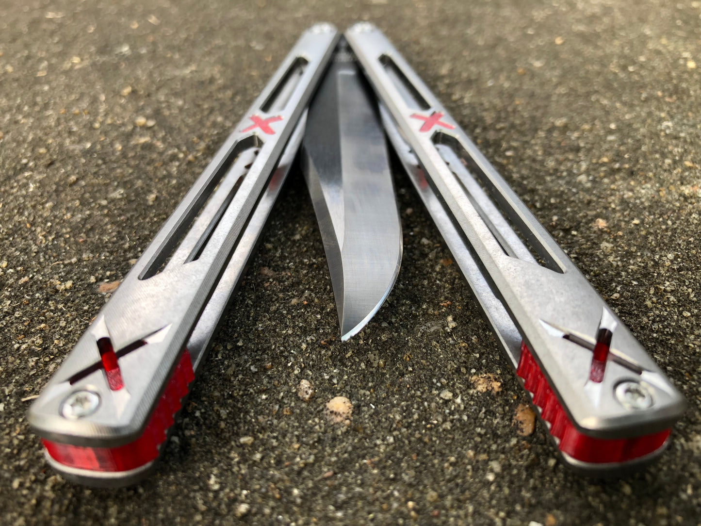 Made by Bxndxge Knives (Bandage, not bondage!) in collaboration with Zippy, the "Stitch" handles are a Titanium rehandle mod compatible with blades from both the BRS Replicant and Squid Industries Krake Raken balisongs.