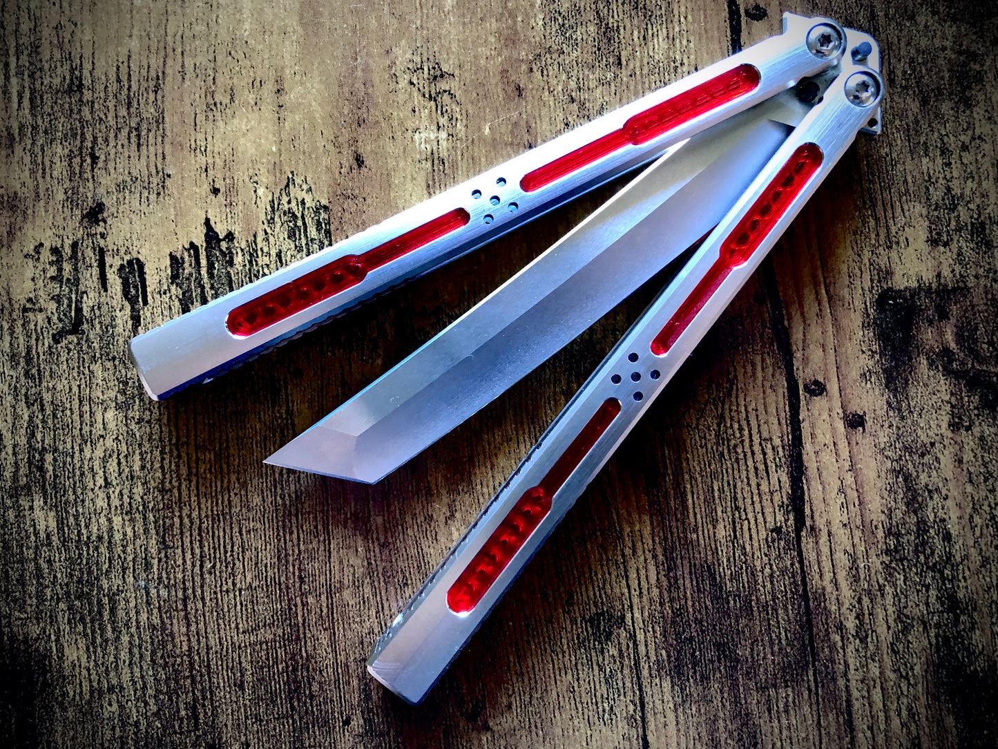 Modify the grip, silence the ring, and deepen the sound of your Tormentum Azoth balisong with these polyurethane Zippy handle inlays.