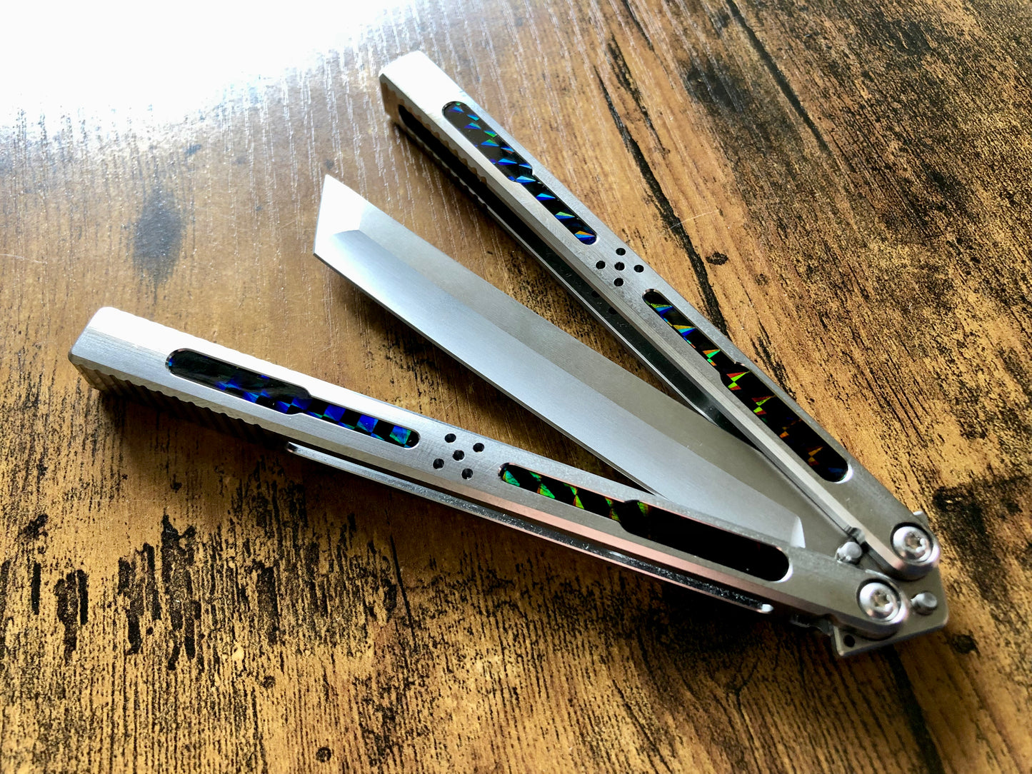 Modify the grip, silence the ring, and deepen the sound of your Tormentum Azoth balisong with these polyurethane Zippy handle inlays.