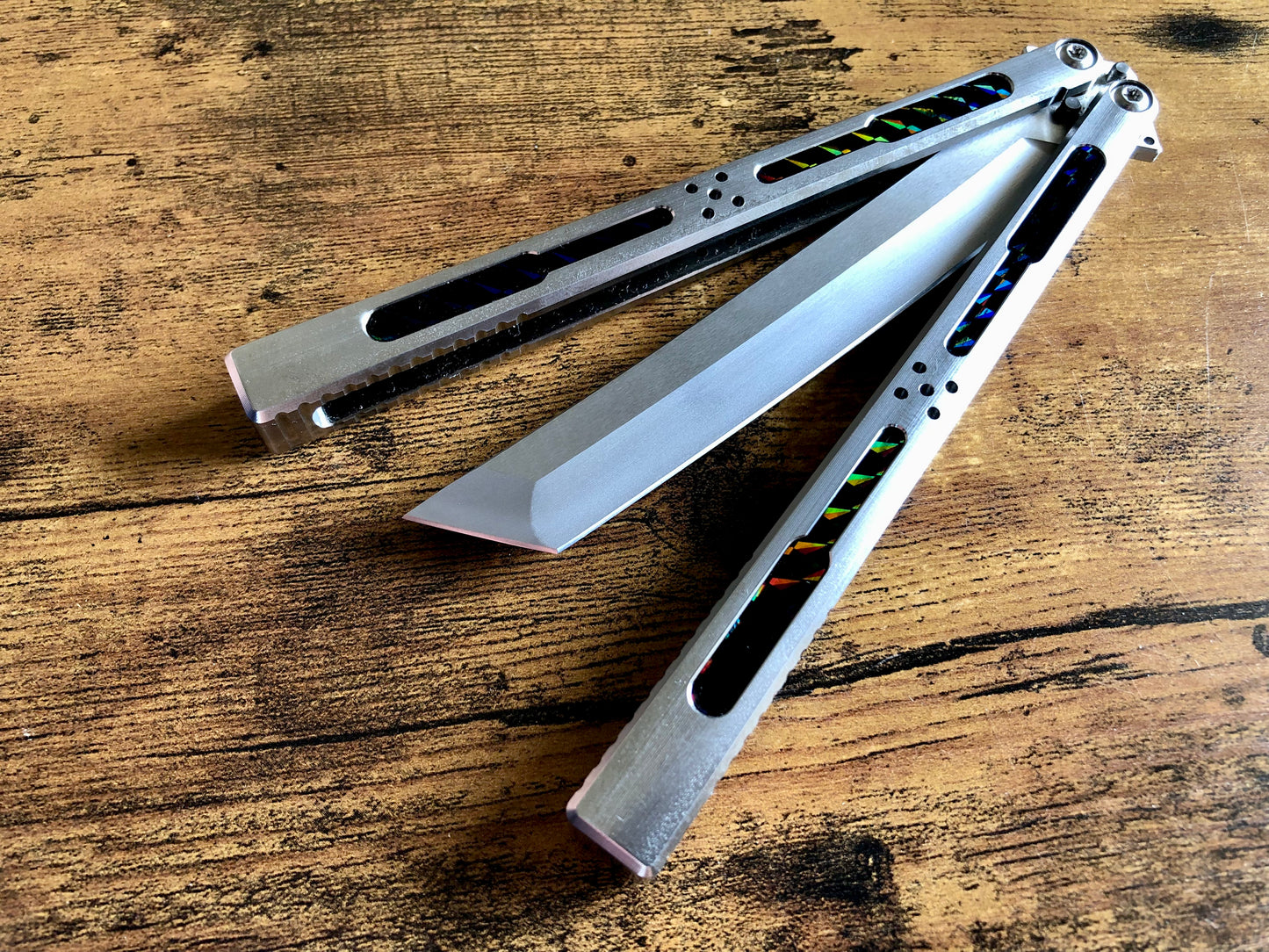 Modify the grip, silence the ring, and deepen the sound of your Tormentum Azoth balisong with these polyurethane Zippy handle inlays.