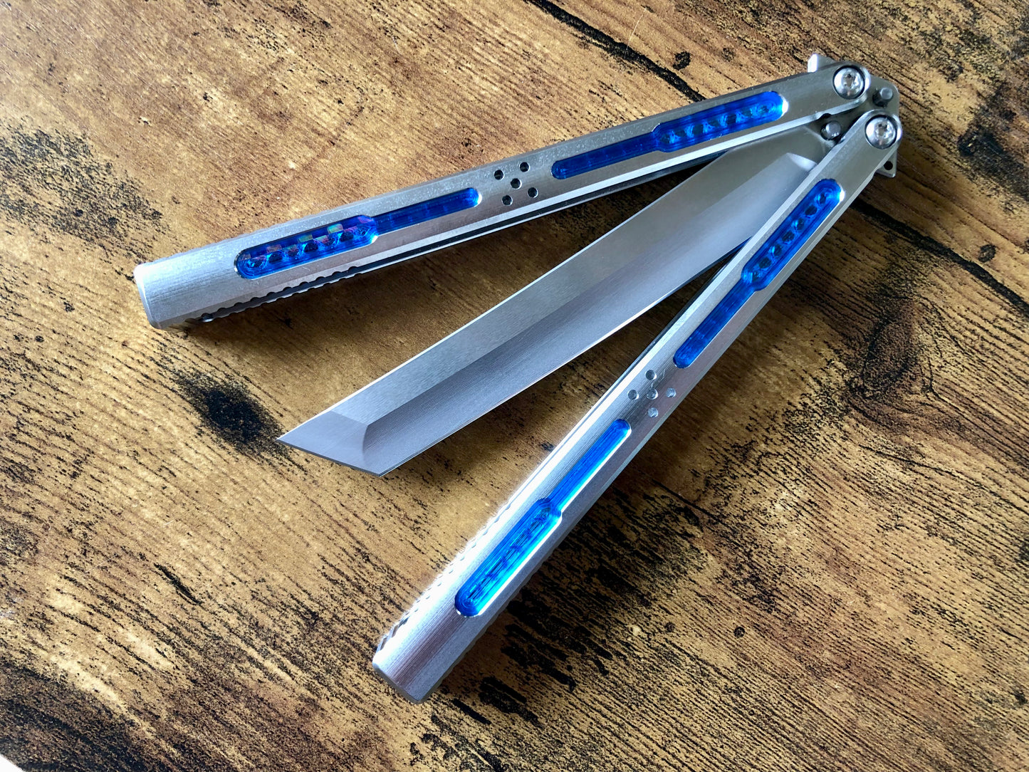Modify the grip, silence the ring, and deepen the sound of your Tormentum Azoth balisong with these polyurethane Zippy handle inlays.