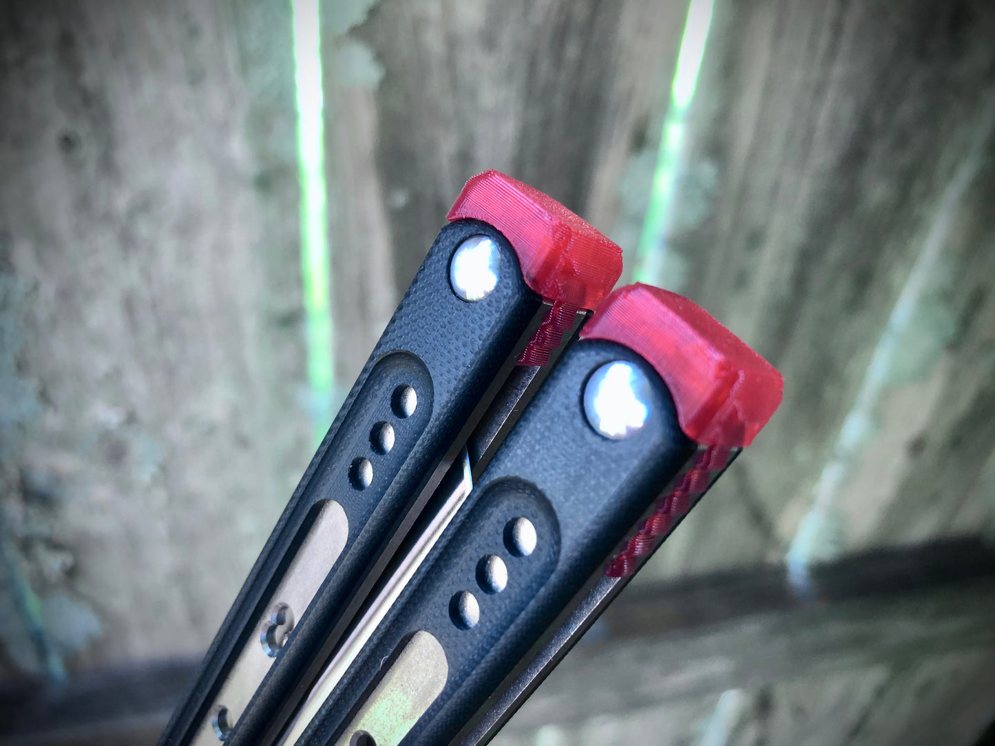 These Black Balisong Rebola v2 spacers are made in-house from a rubbery, shatter-proof polyurethane. They are ultra-lightweight extension spacers that reduce the stock handle-bias. They also feature positive sawtooth jimping and enable adjustable balance with up to 1x removable tungsten weight per spacer.