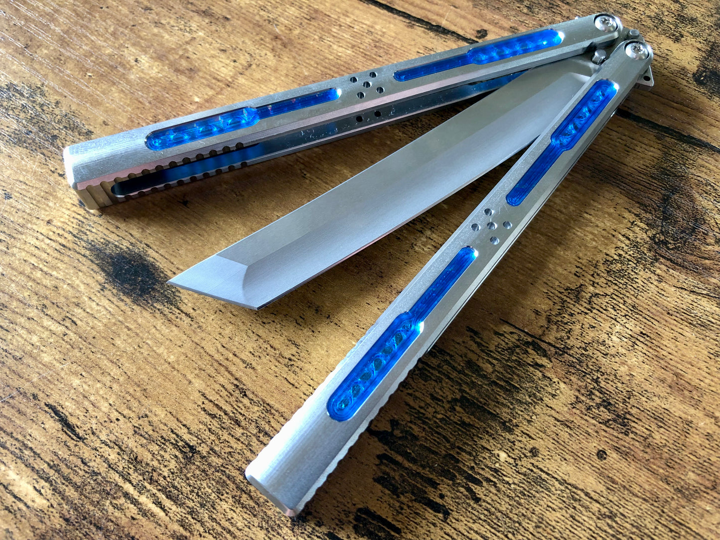 Modify the grip, silence the ring, and deepen the sound of your Tormentum Azoth balisong with these polyurethane Zippy handle inlays.
