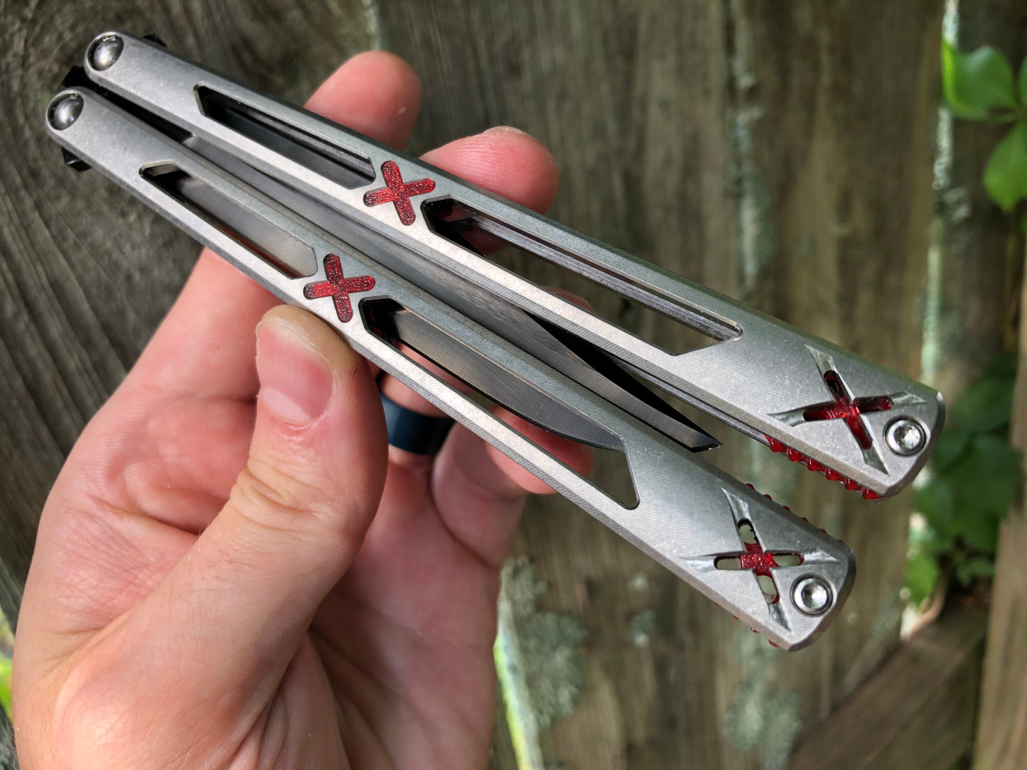 Made by Bxndxge Knives (Bandage, not bondage!) in collaboration with Zippy, the "Stitch" handles are a Titanium rehandle mod compatible with blades from both the BRS Replicant and Squid Industries Krake Raken balisongs.