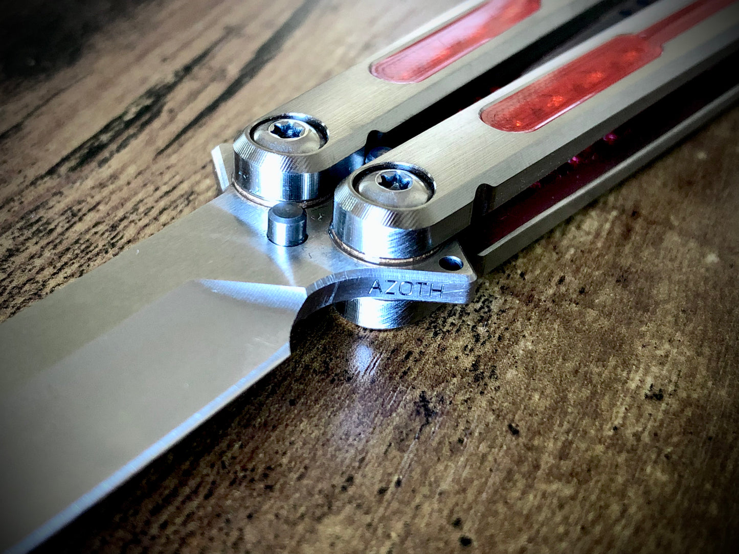 Modify the grip, silence the ring, and deepen the sound of your Tormentum Azoth balisong with these polyurethane Zippy handle inlays.