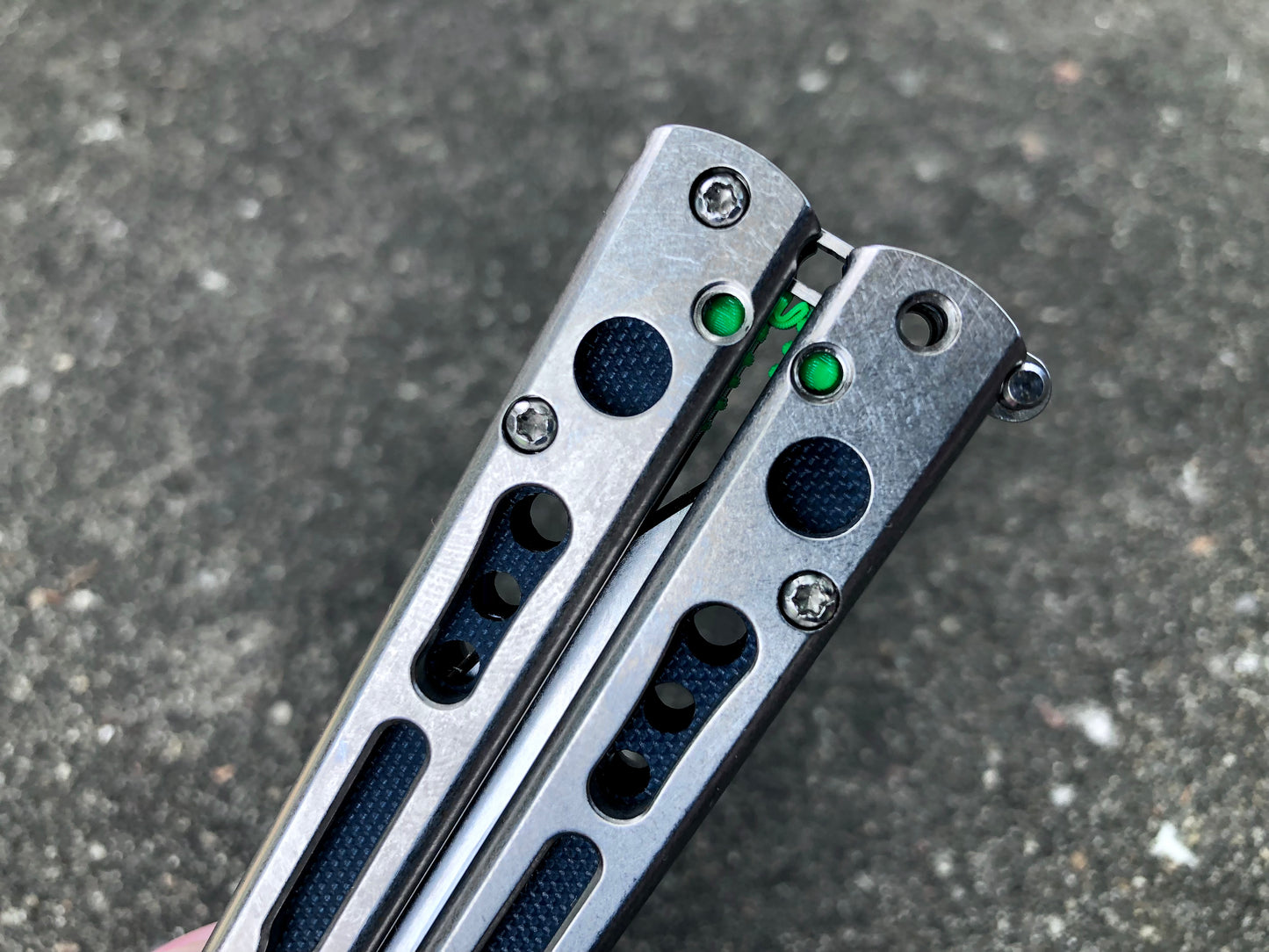 Make your HOM Chimera balisong a more neutral flipper with Zippy spacers: full-length spacers with jimping, or spring-latch spacers that counterweight the safe handle for improved balance.
