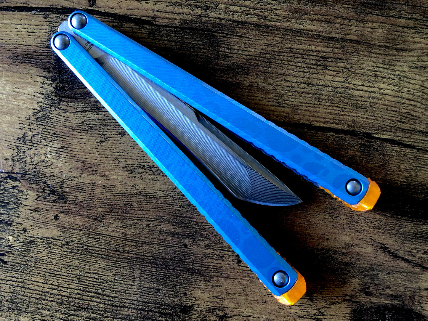 These Zippy spacers designed for the Fellowship Blades Gaboon balisong are made in-house from a rubbery, shatter-proof polyurethane. They add additional jimping to the Gaboon, provide a more neutral balance, and are also available as extensions which add handle length, protect the handles from drops, and include an adjustable tungsten weight system.