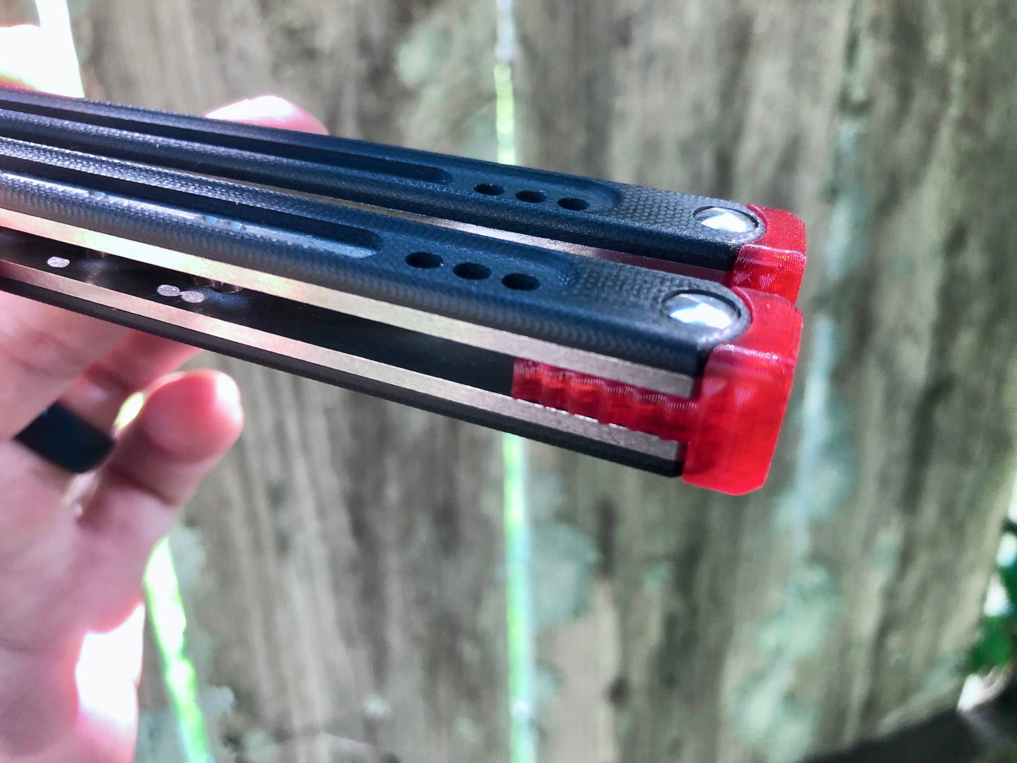 These Black Balisong Rebola v2 spacers are made in-house from a rubbery, shatter-proof polyurethane. They are ultra-lightweight extension spacers that reduce the stock handle-bias. They also feature positive sawtooth jimping and enable adjustable balance with up to 1x removable tungsten weight per spacer.