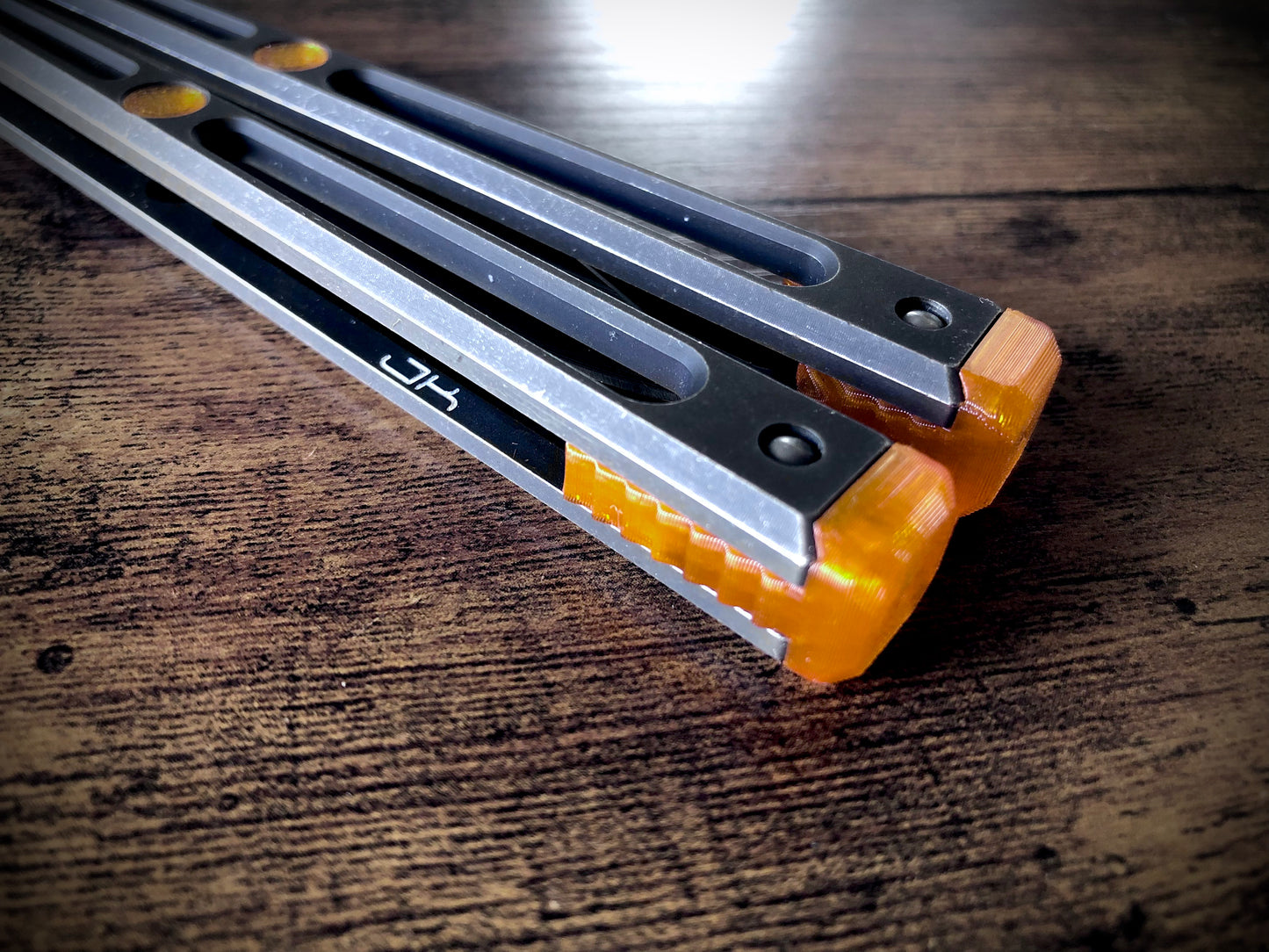 Extend and protect your handles with these Zippy spacers, custom-made for the Goose balisong (designed by Arthur Goins and machined by JK Design). The spacers are made from a shatter-proof polyurethane and protect your handles from drops while adding length. The spacers also feature positive sawtooth jimping and adjustable balance.
