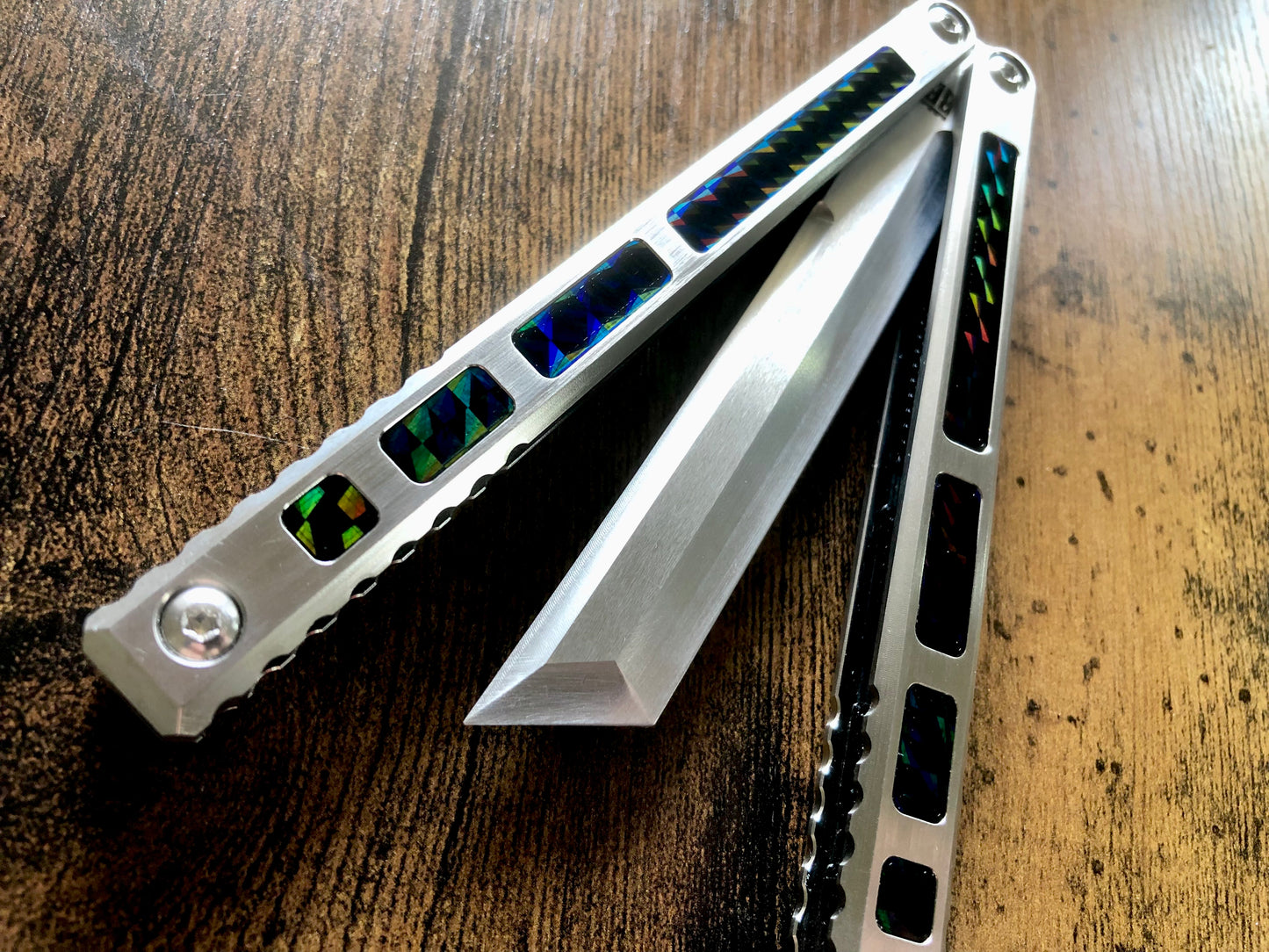 Modify the ergo, deepen the sound, and add a pop of color to your B.A. Balis Tesseract balisong with these polyurethane Zippy handle inlays.