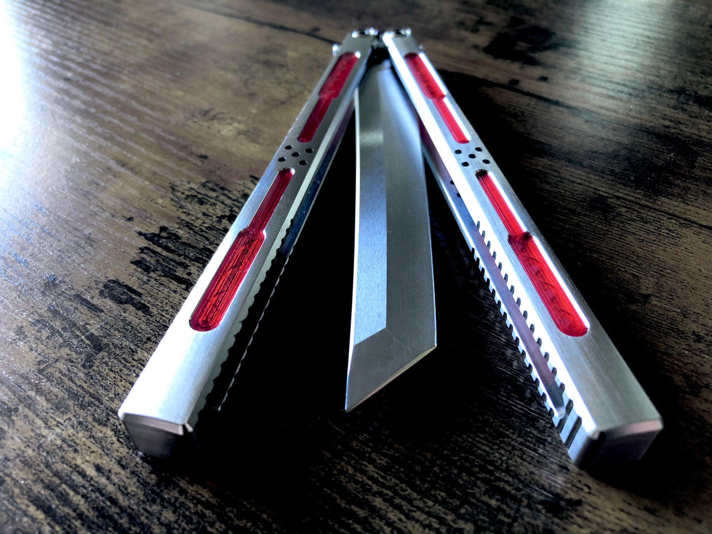 Modify the grip, silence the ring, and deepen the sound of your Tormentum Azoth balisong with these polyurethane Zippy handle inlays.