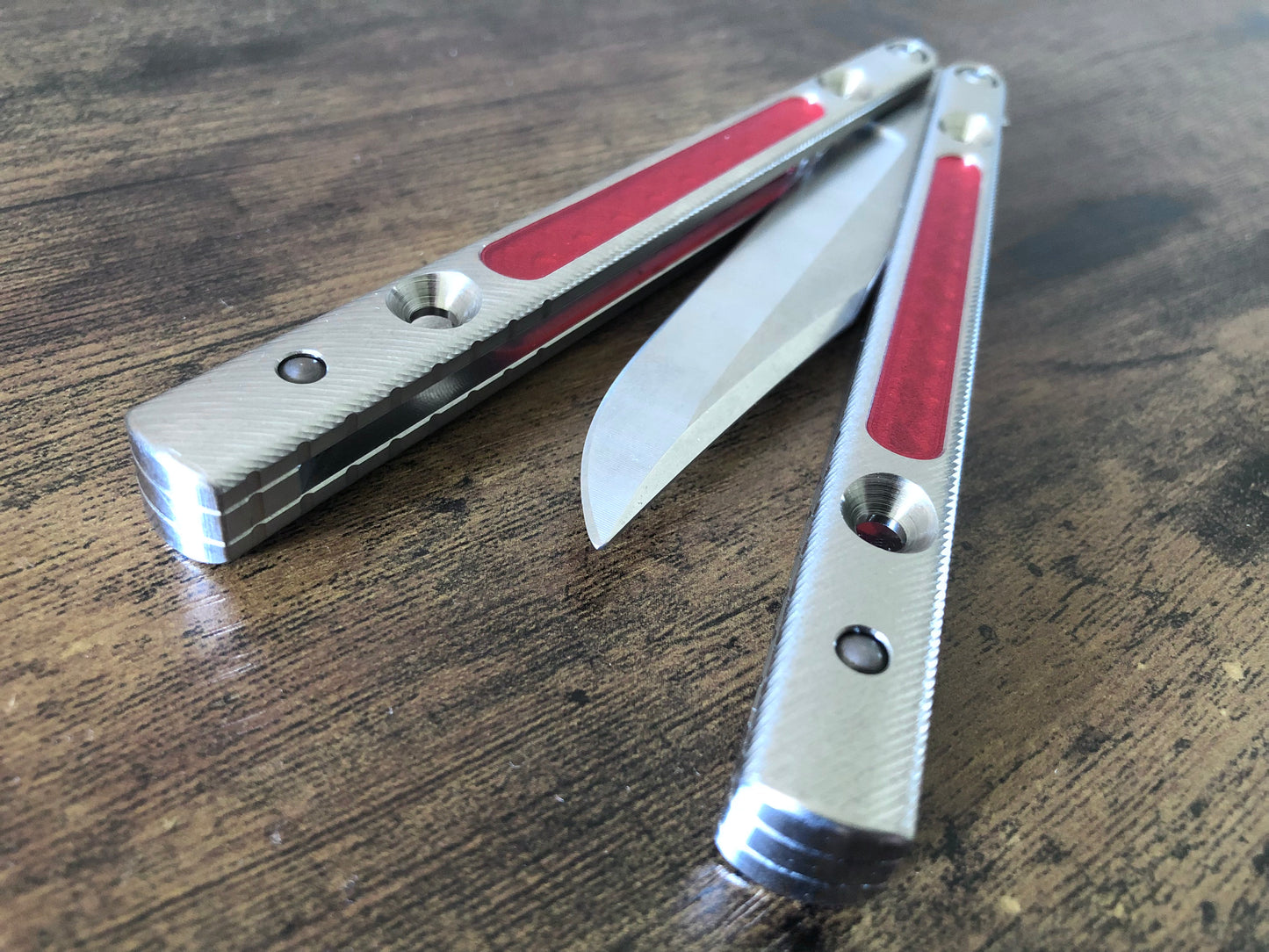 Add grip, comfort, and eliminate ring with these Zippy polyurethane handle inlays designed to fit the titanium Squiggle handles for the Squid Industries Krake Raken balisong.